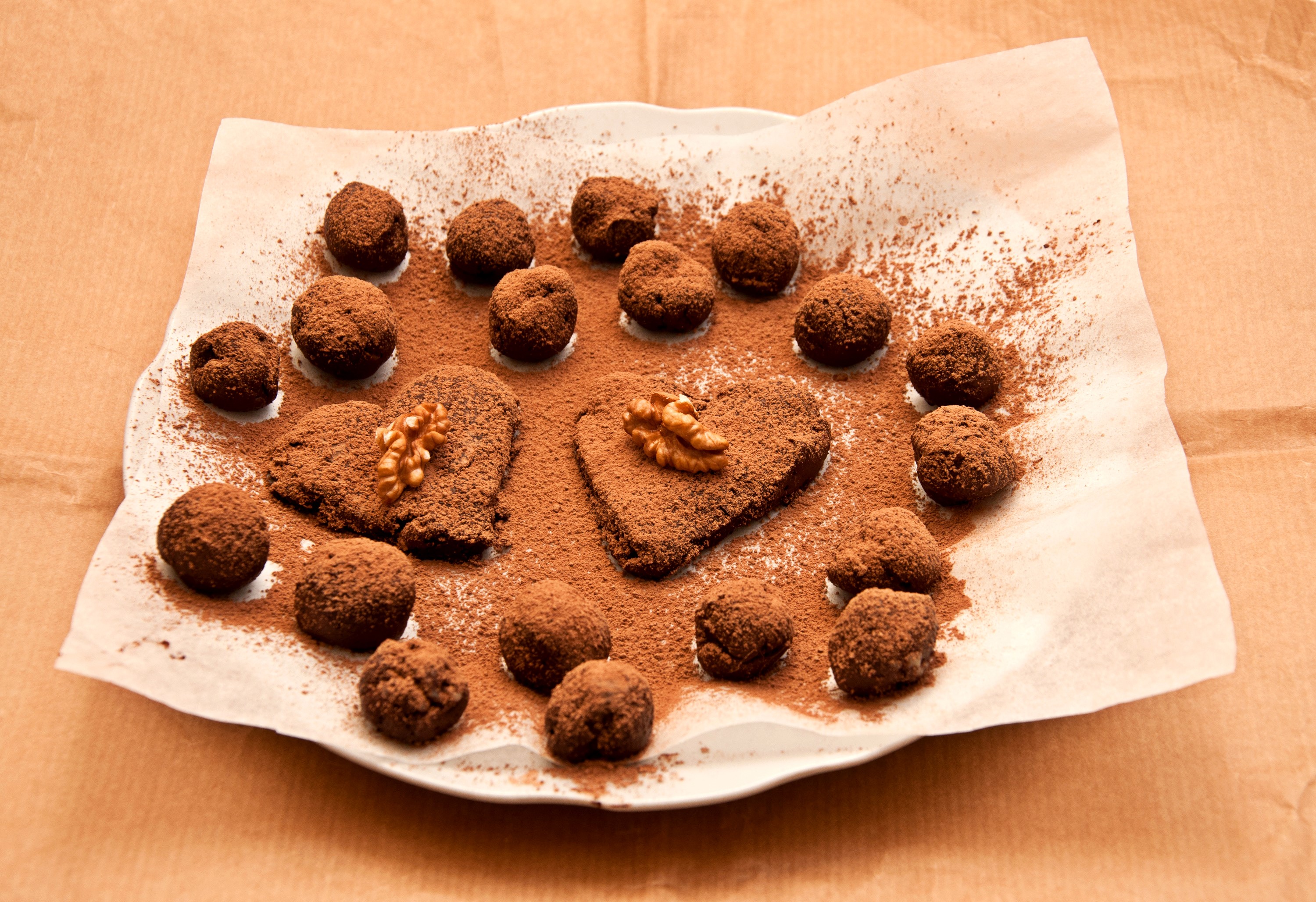 Heart-shaped chocolates and cocoa truffles dusted with cocoa powder HD Wallpaper