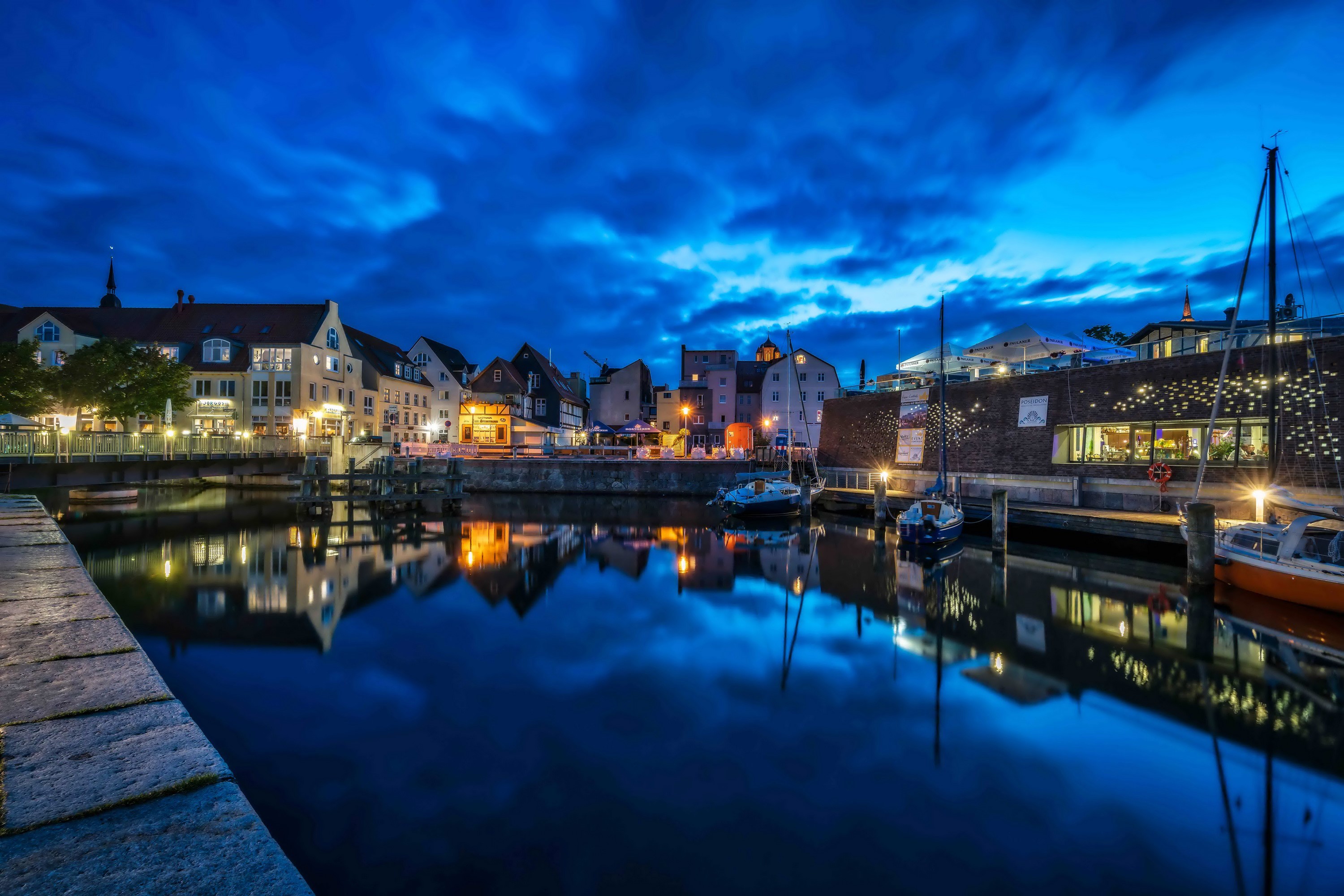 Port Stralsund Germany at Night with River and Boats HD Wallpaper