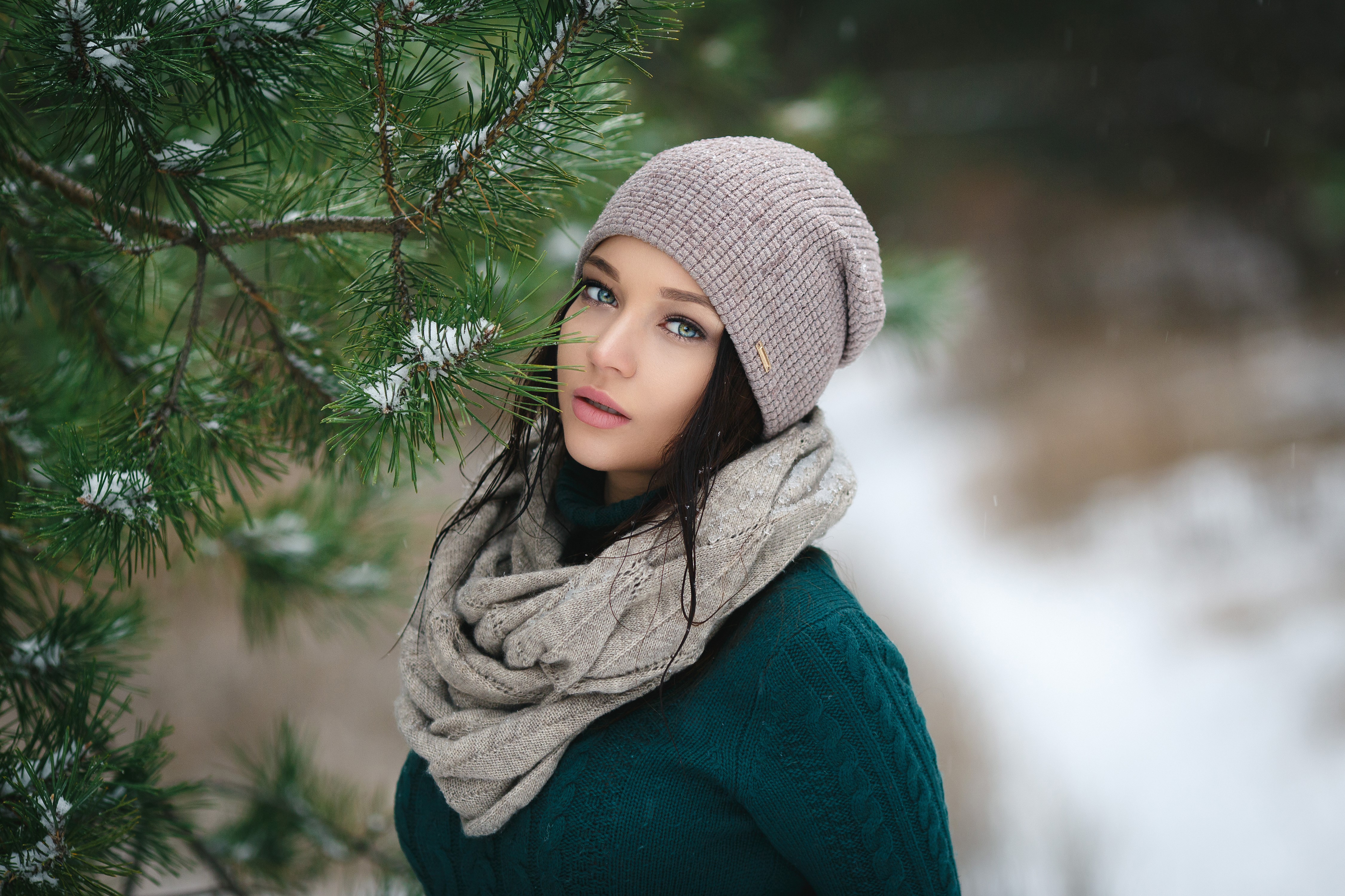 Angelina Petrova in winter with pine branches HD Wallpaper