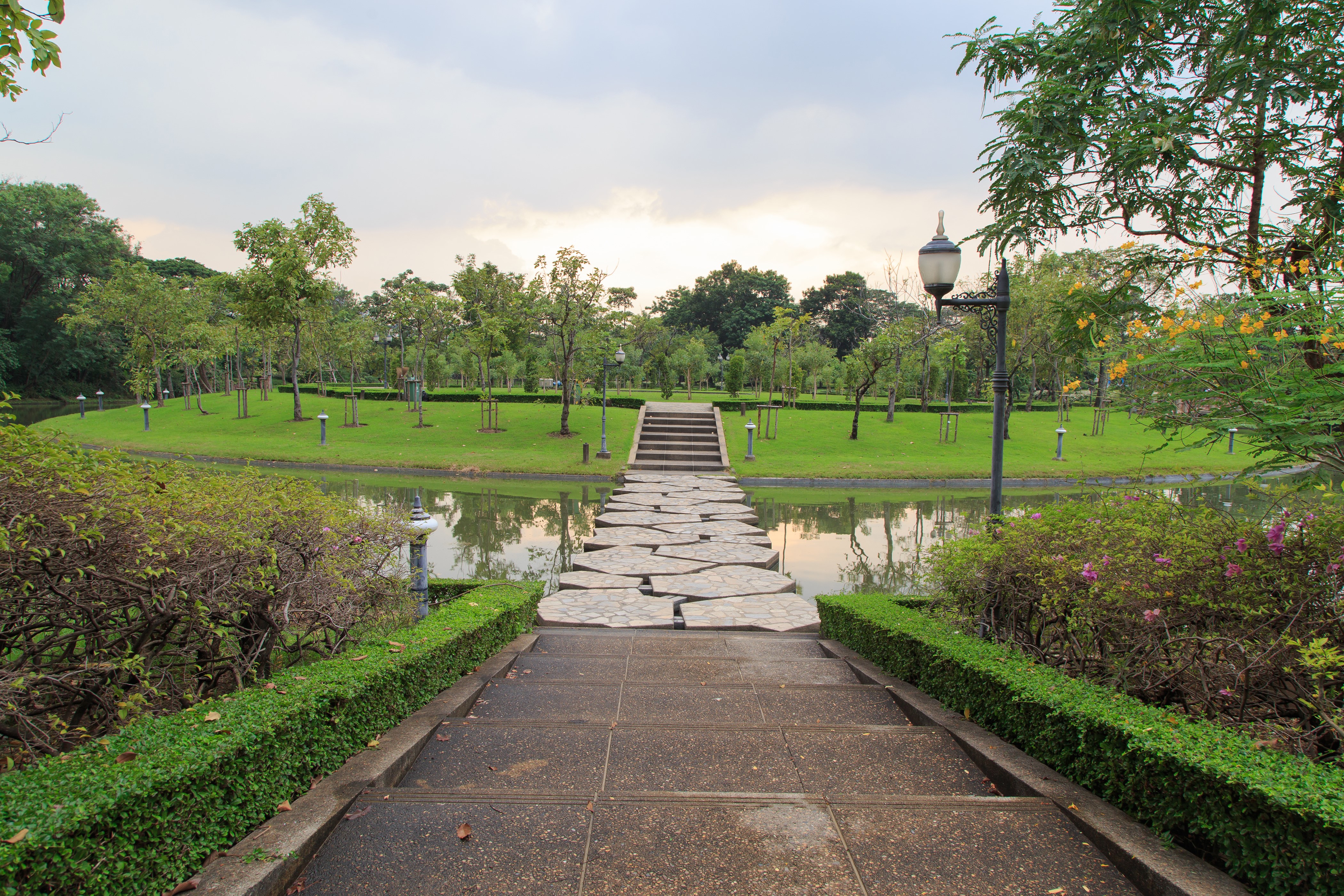 Park with pond and stone bridge in Bangkok, Thailand HD Wallpaper