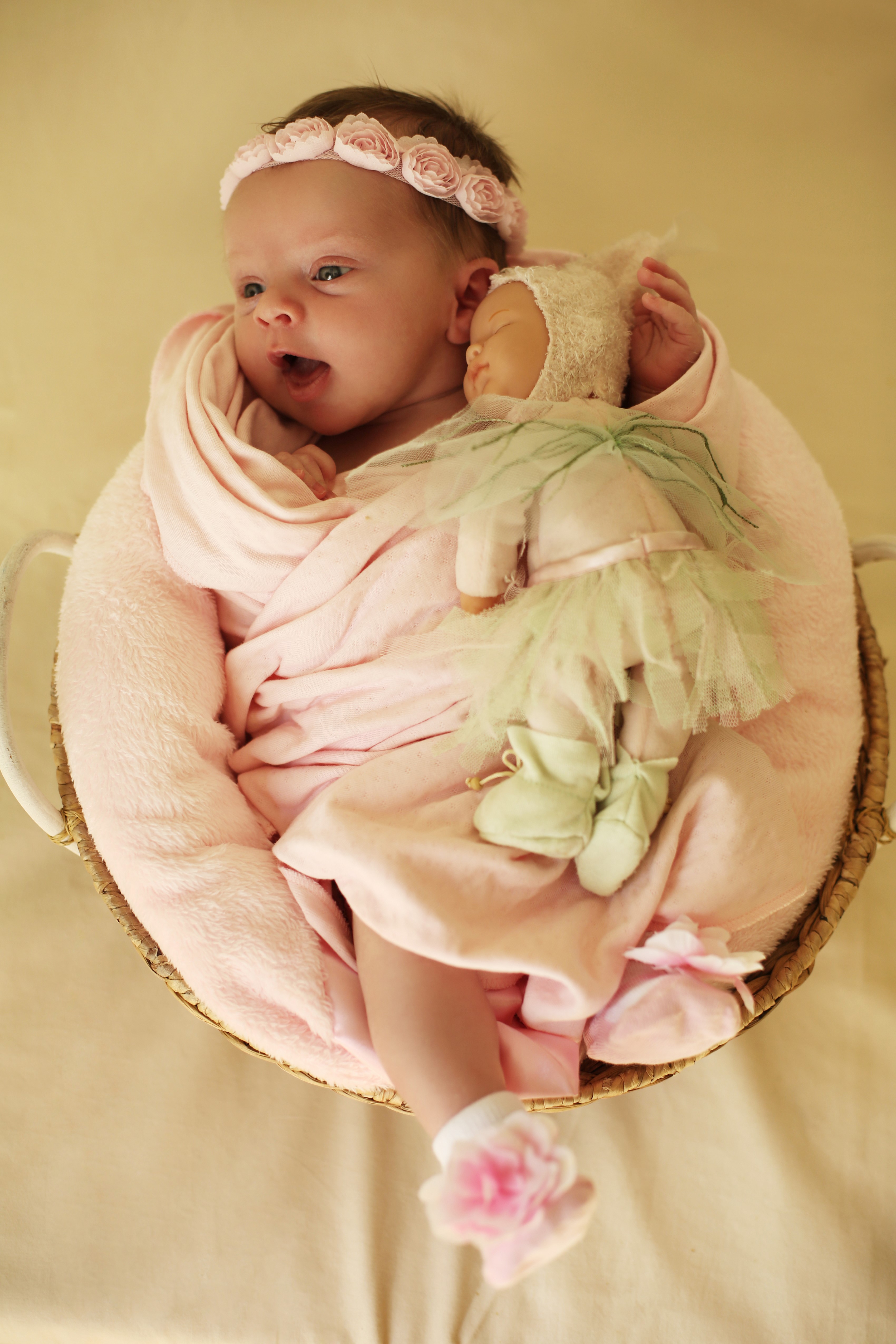 Baby girl with doll in a basket HD Phone Wallpaper
