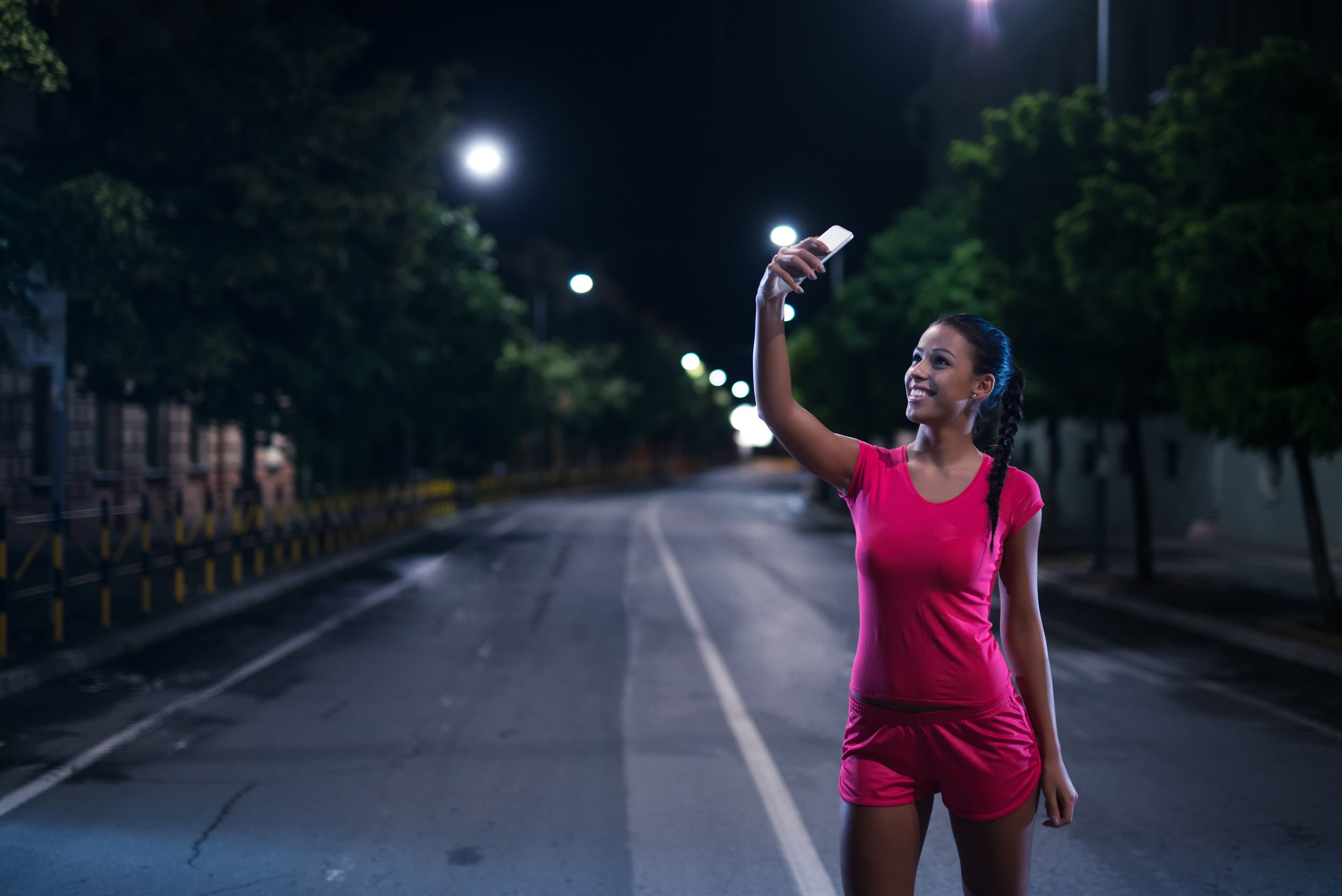 Brunette girl taking a selfie at night HD Wallpaper