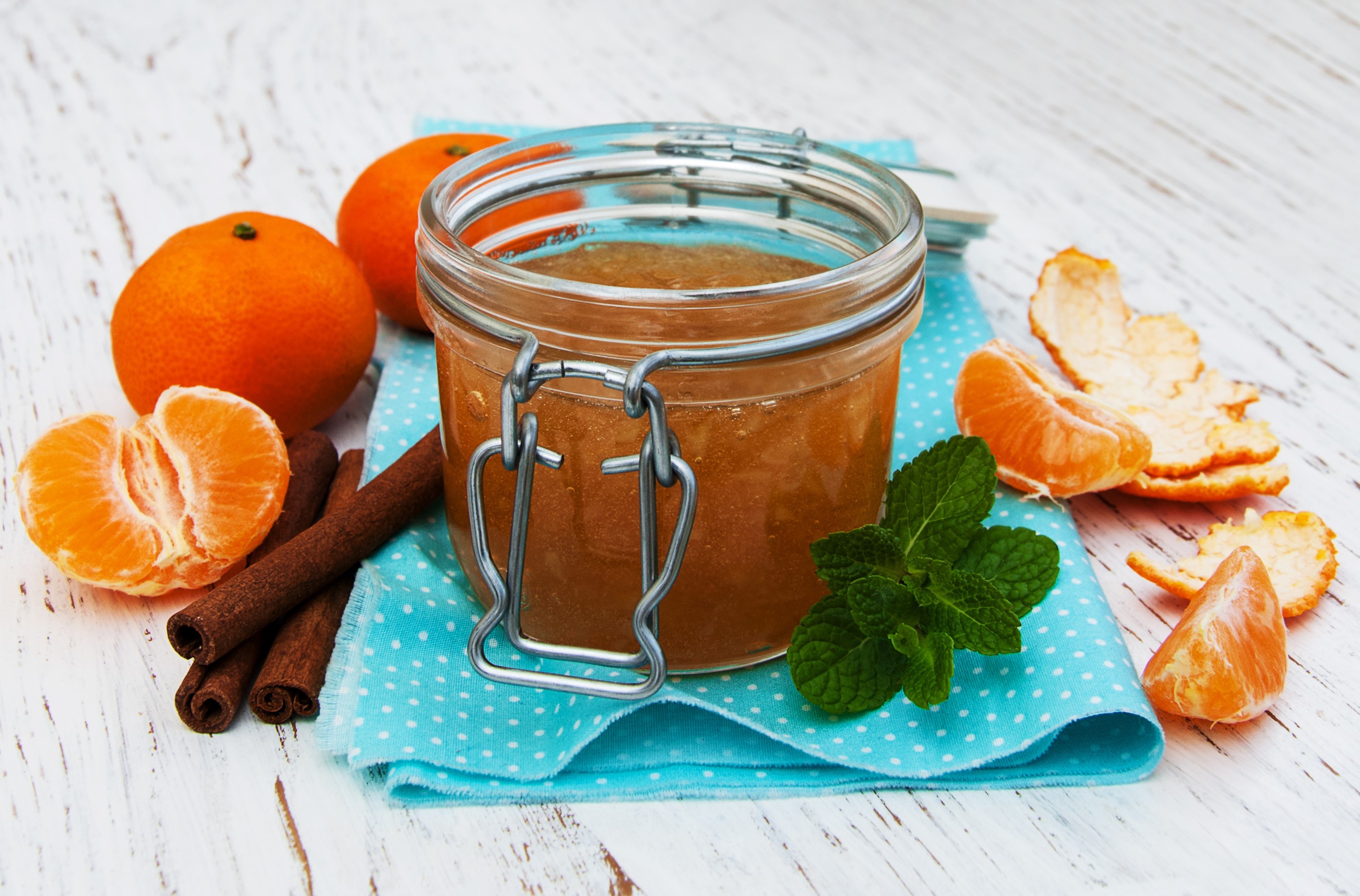 Jar of mandarin jam with cinnamon and mint HD Wallpaper