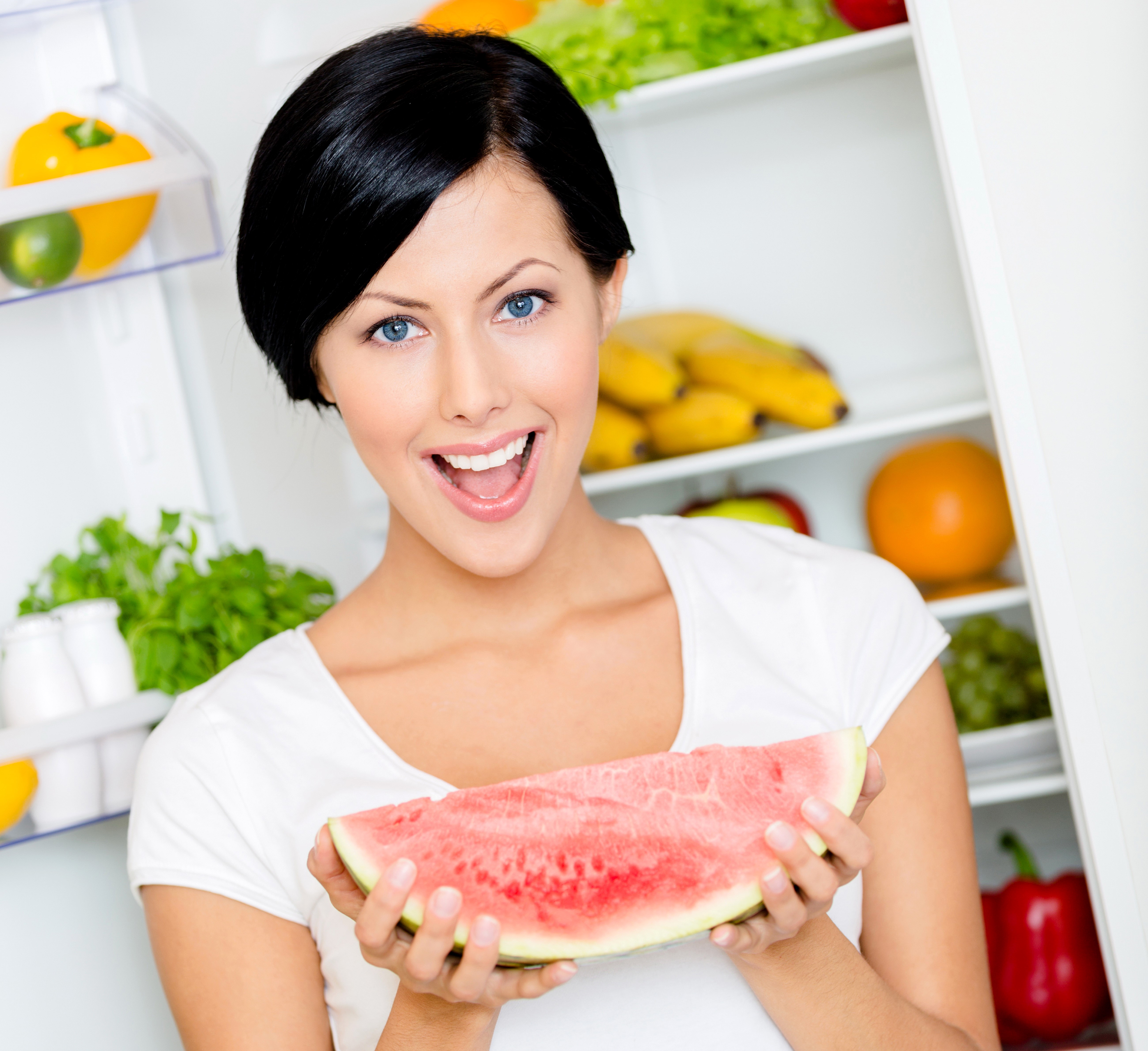 Brunette girl holding watermelon in refrigerator HD Wallpaper