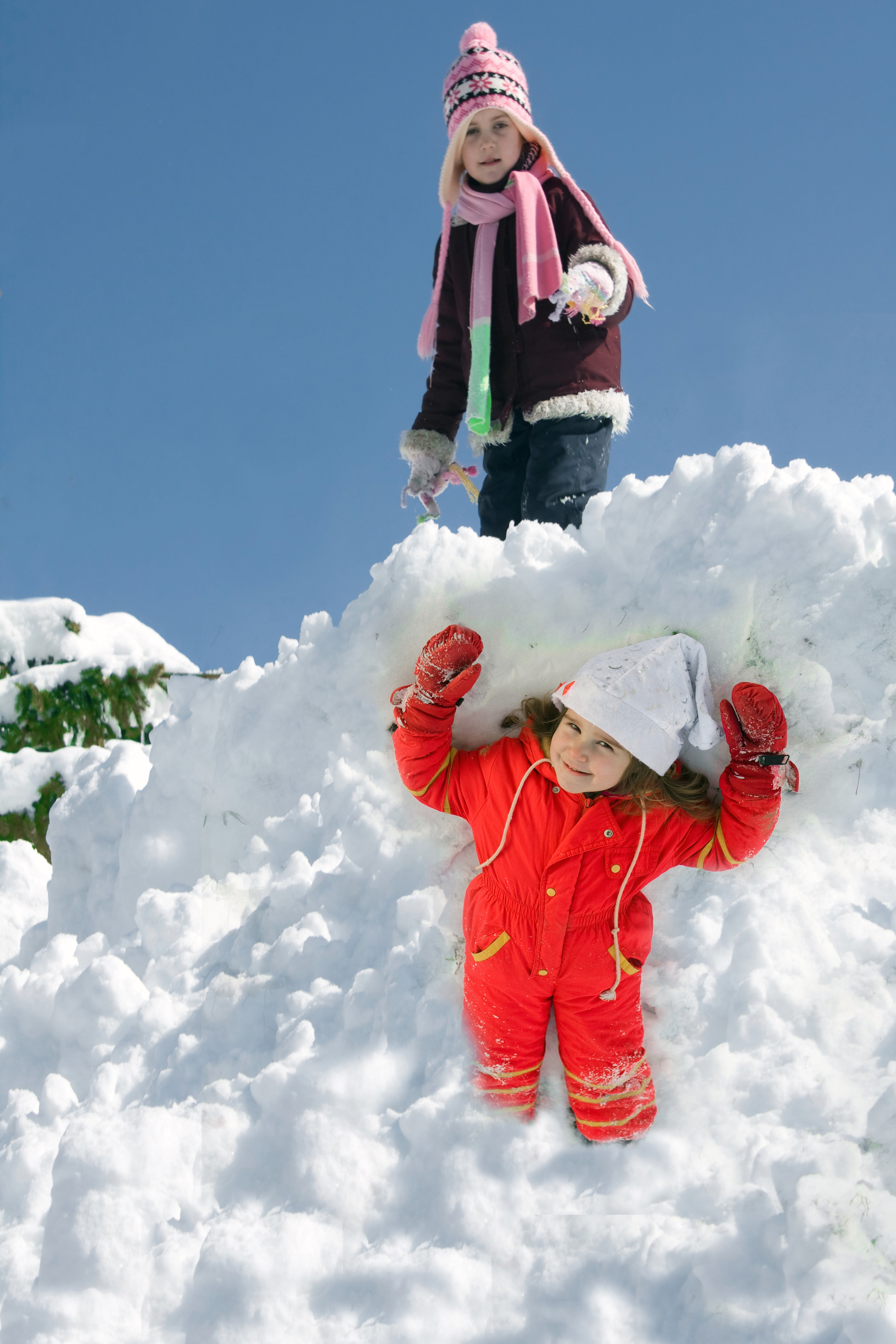 Two girls playing in the snow HD Phone Wallpaper