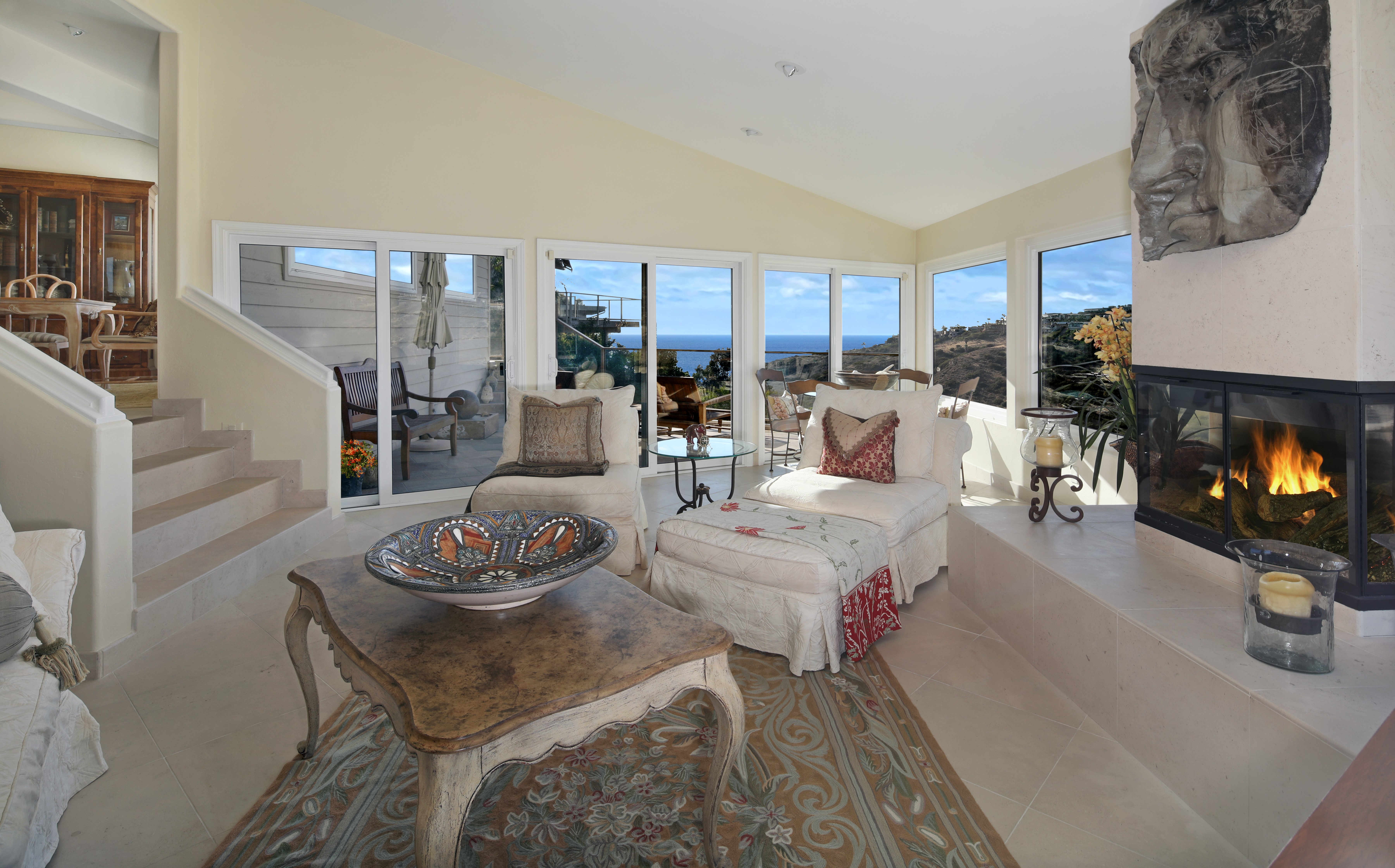 Living room with fireplace and ocean view HD Wallpaper