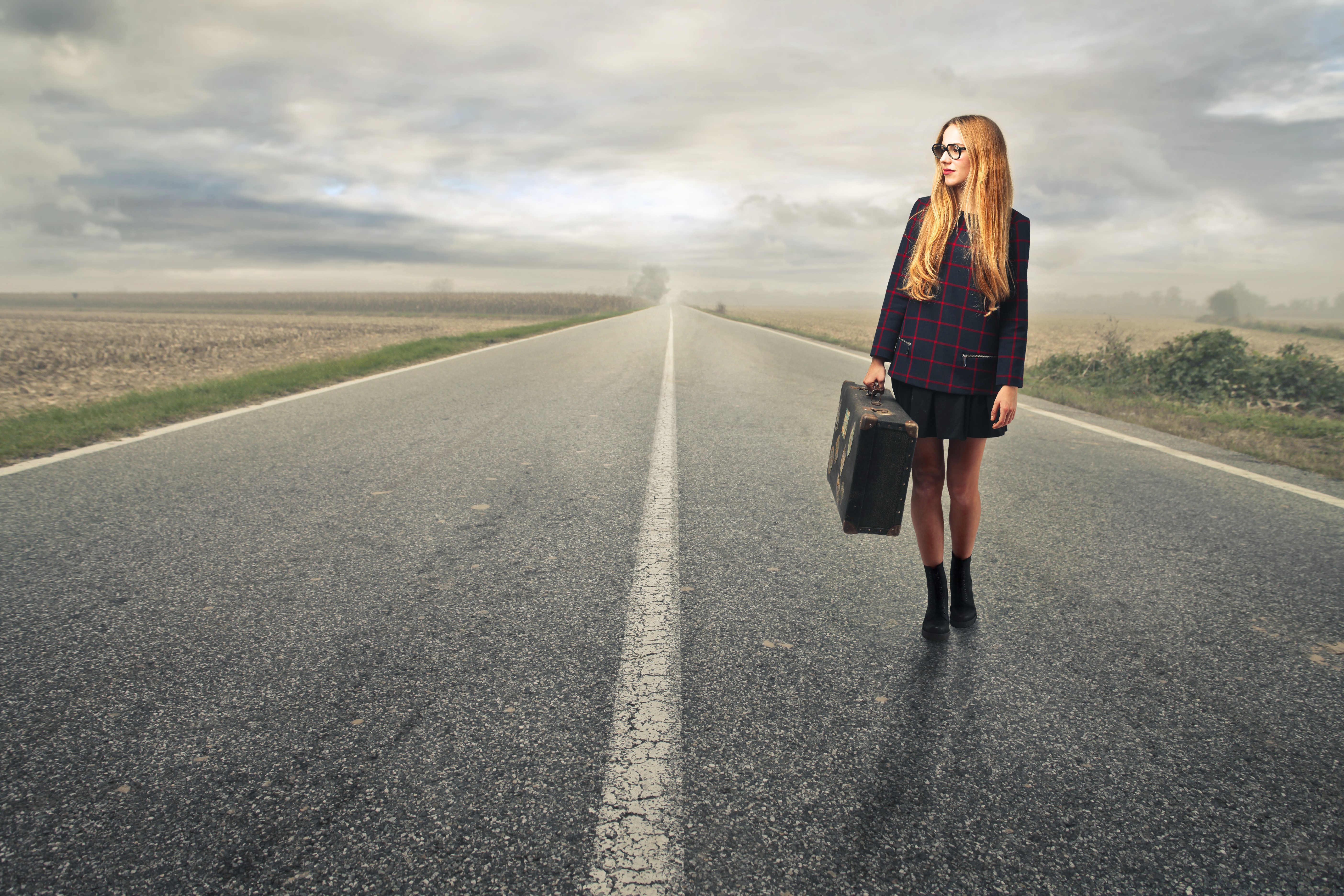 Redhead girl with suitcase on a road HD Wallpaper