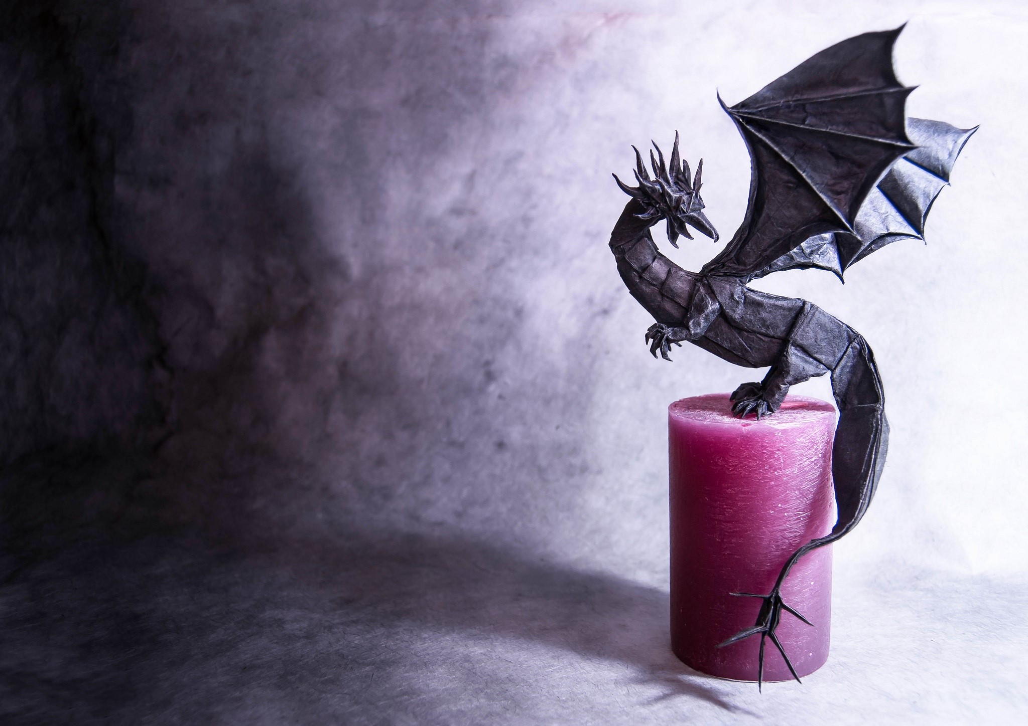 Origami dragon on a pink candle HD Wallpaper