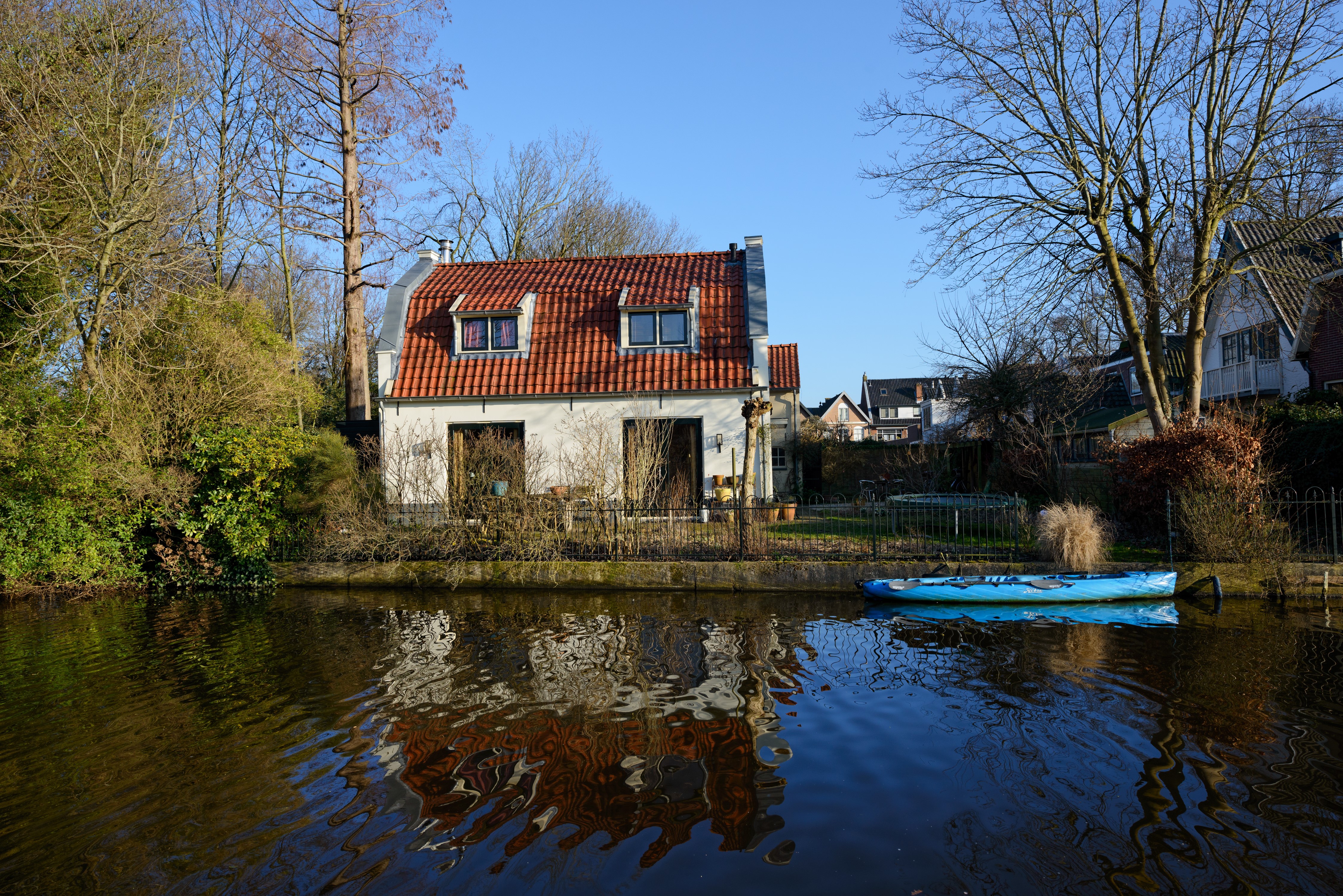 House by the river in Abcoude, Netherlands with a boat HD Wallpaper