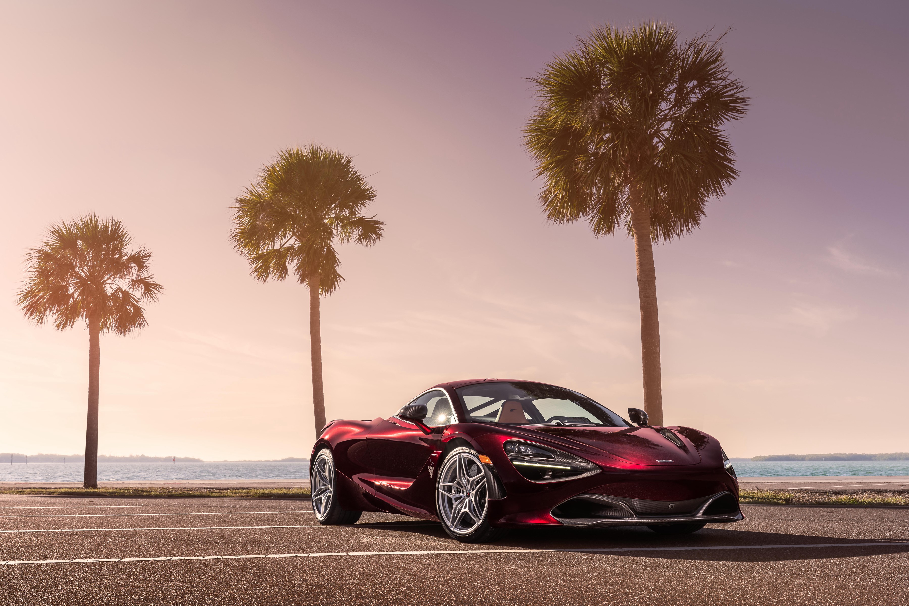 Red McLaren 720S Coupe parked by the ocean with palm trees HD Wallpaper