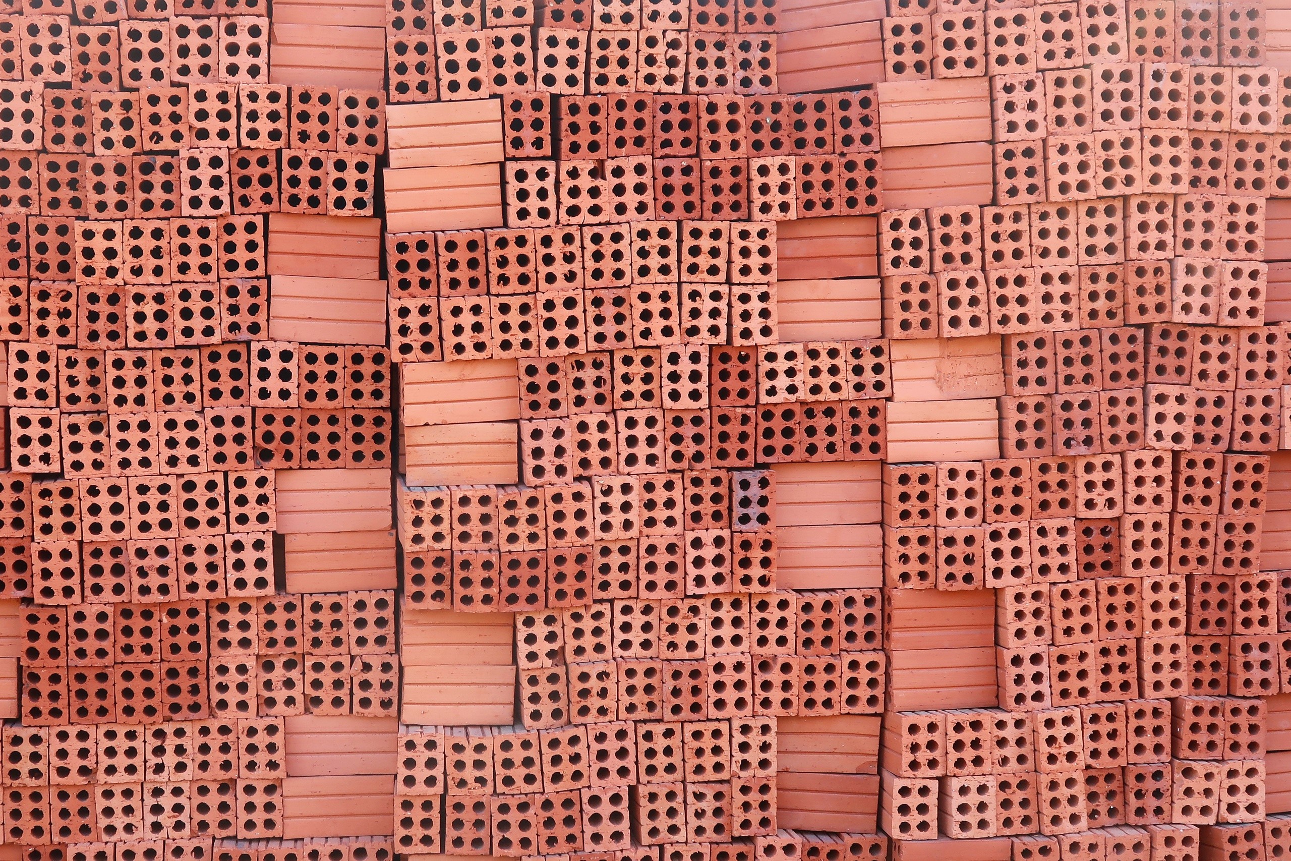 Stack of red bricks HD Wallpaper