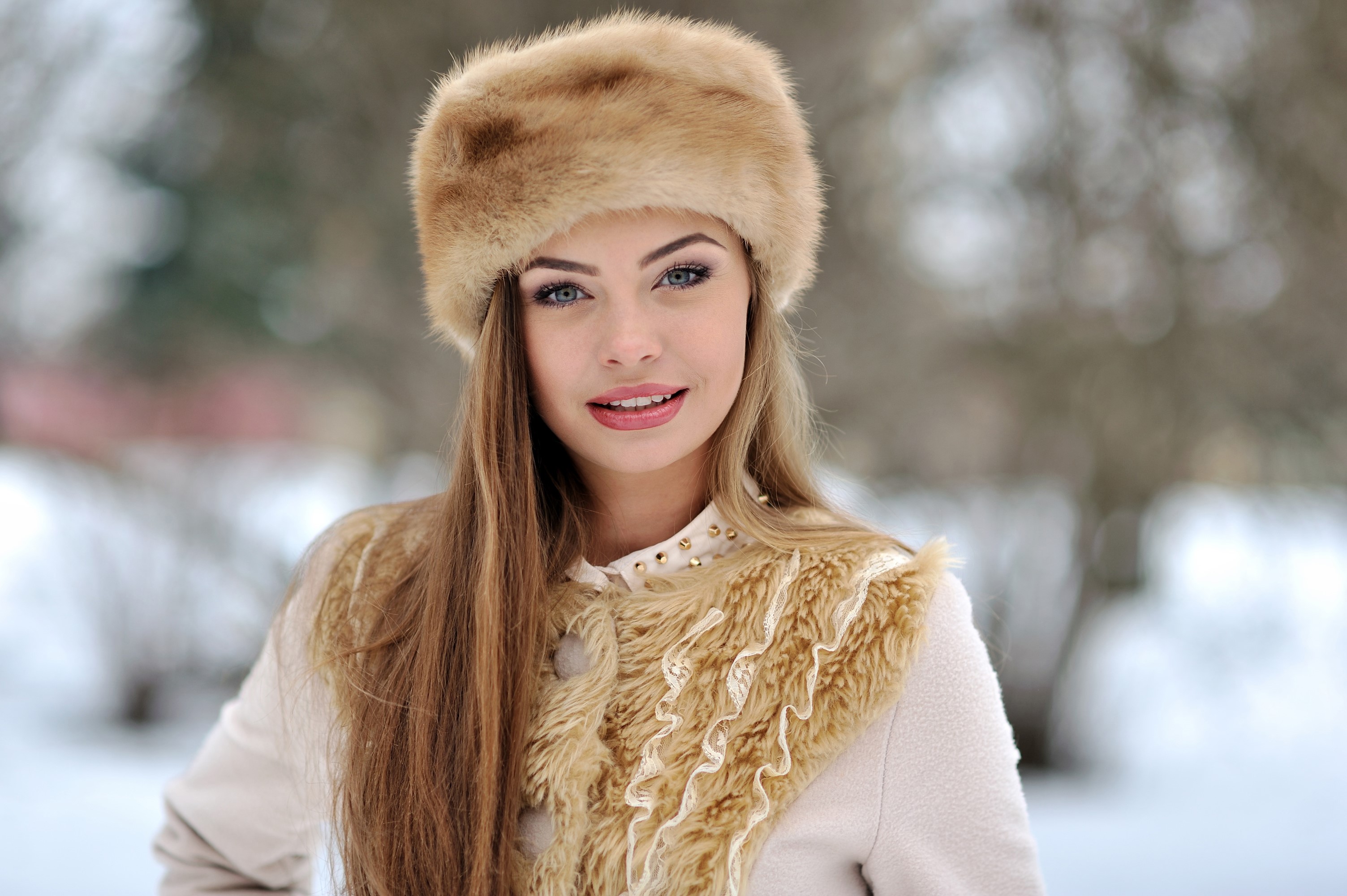 Woman with dark blonde hair wearing a fur hat HD Wallpaper
