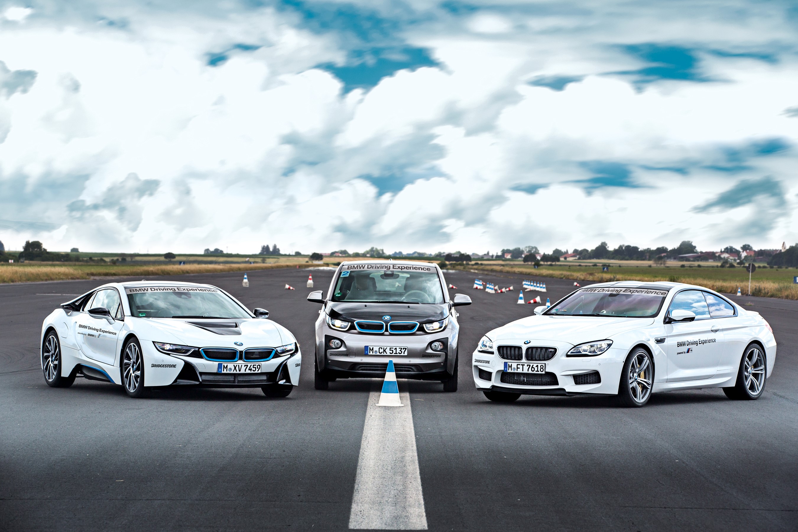 Three white BMW cars on a track HD Wallpaper