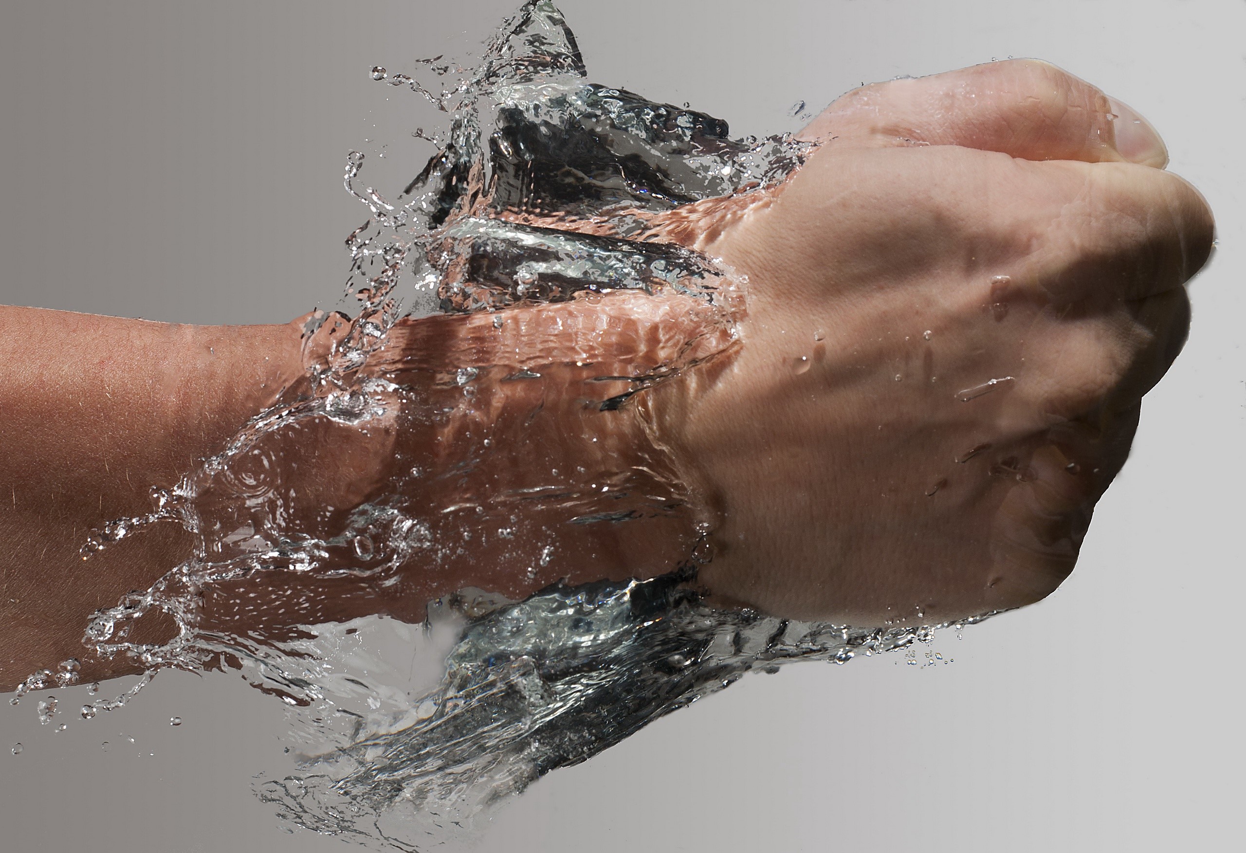 Fist punching through water HD Wallpaper