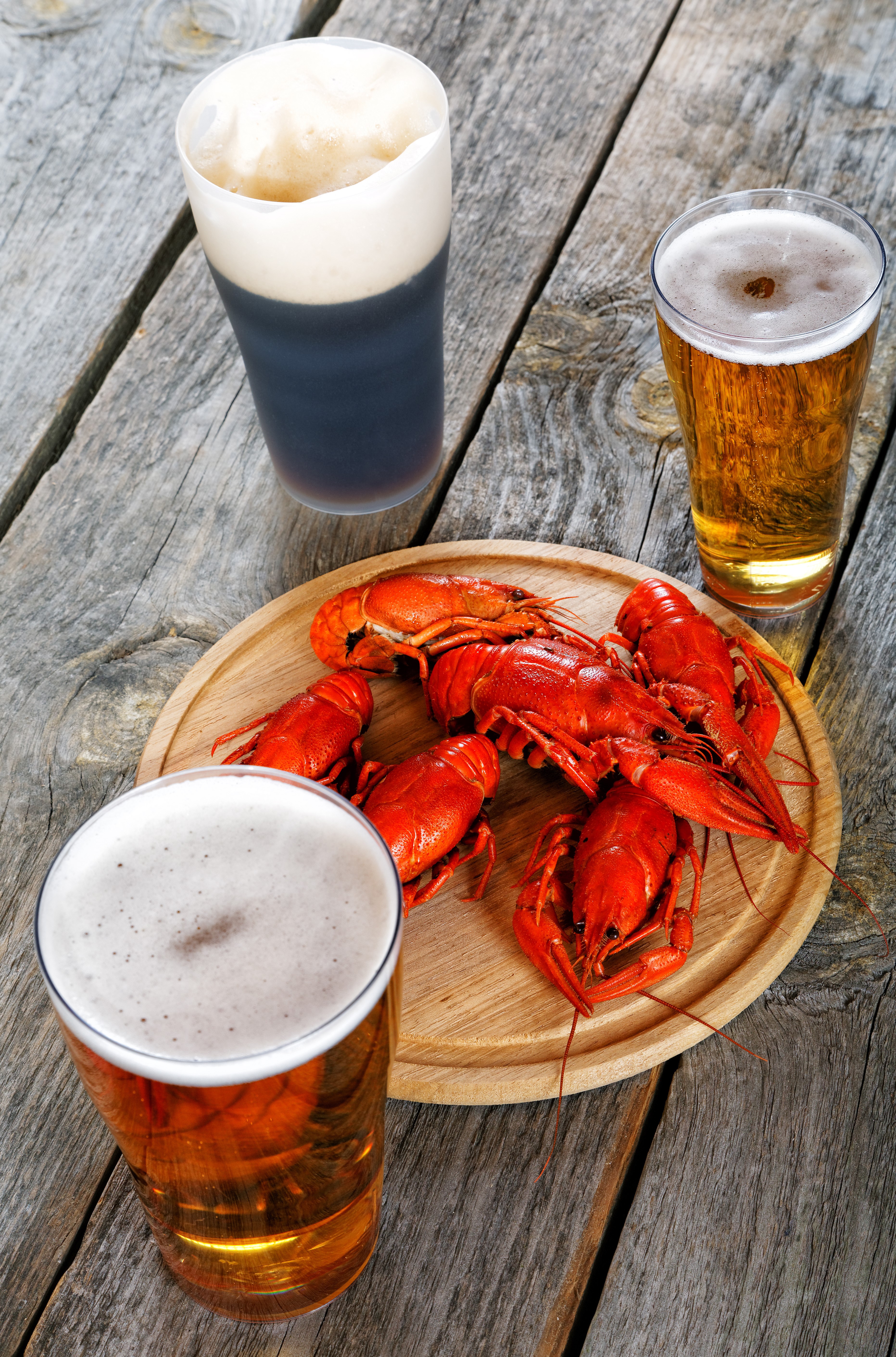 Three beers and crayfish on a wooden table HD Phone Wallpaper