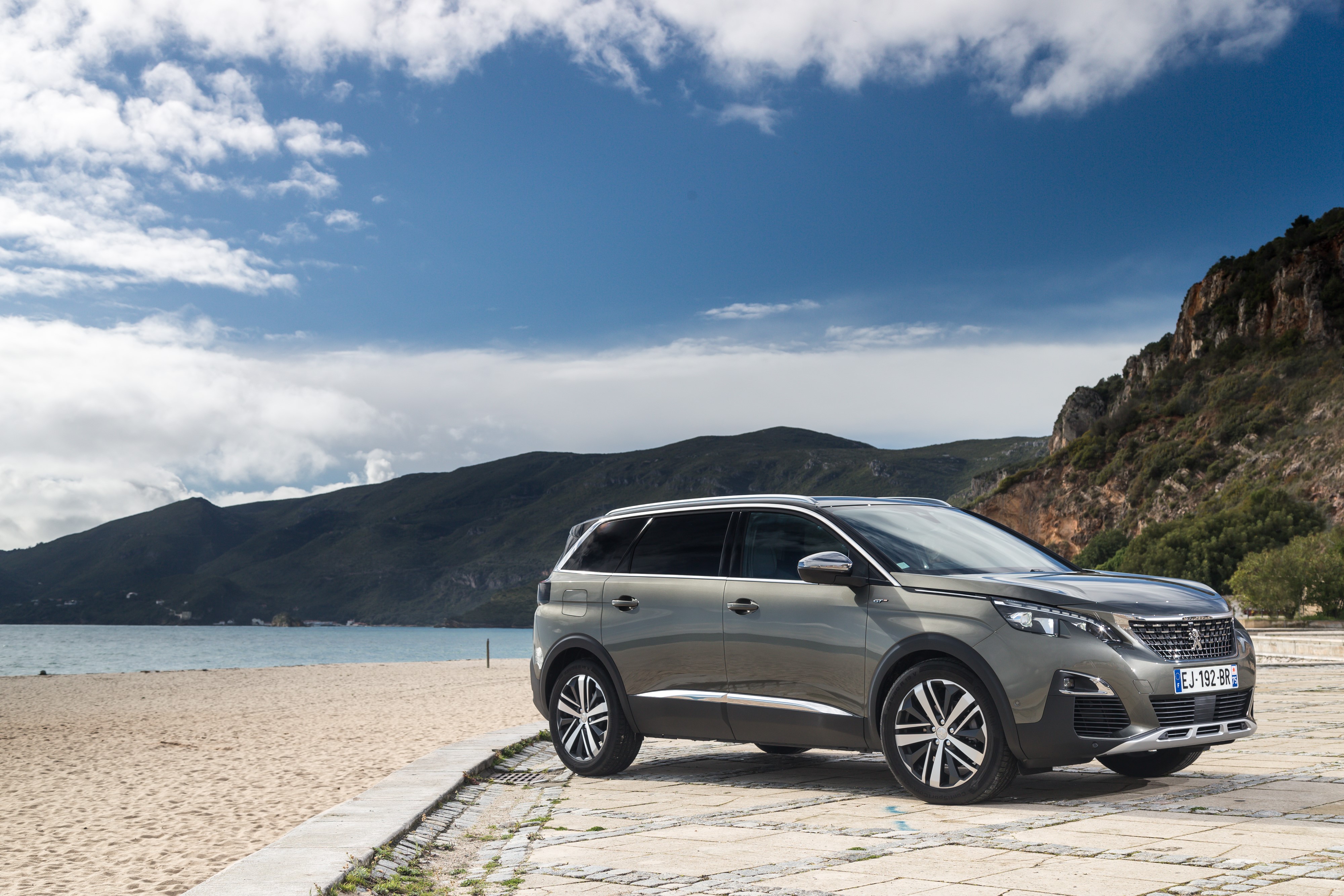 Peugeot 5008 SUV on a beach HD Wallpaper