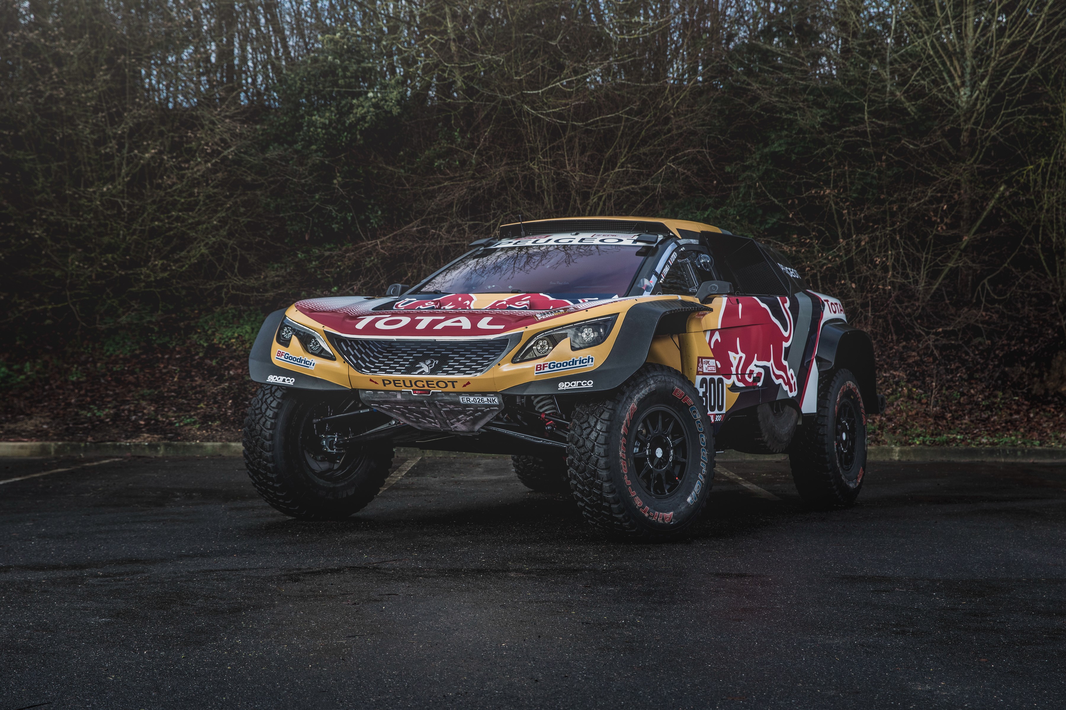 Peugeot 3008 DKR rally car with Red Bull and Total branding HD Wallpaper