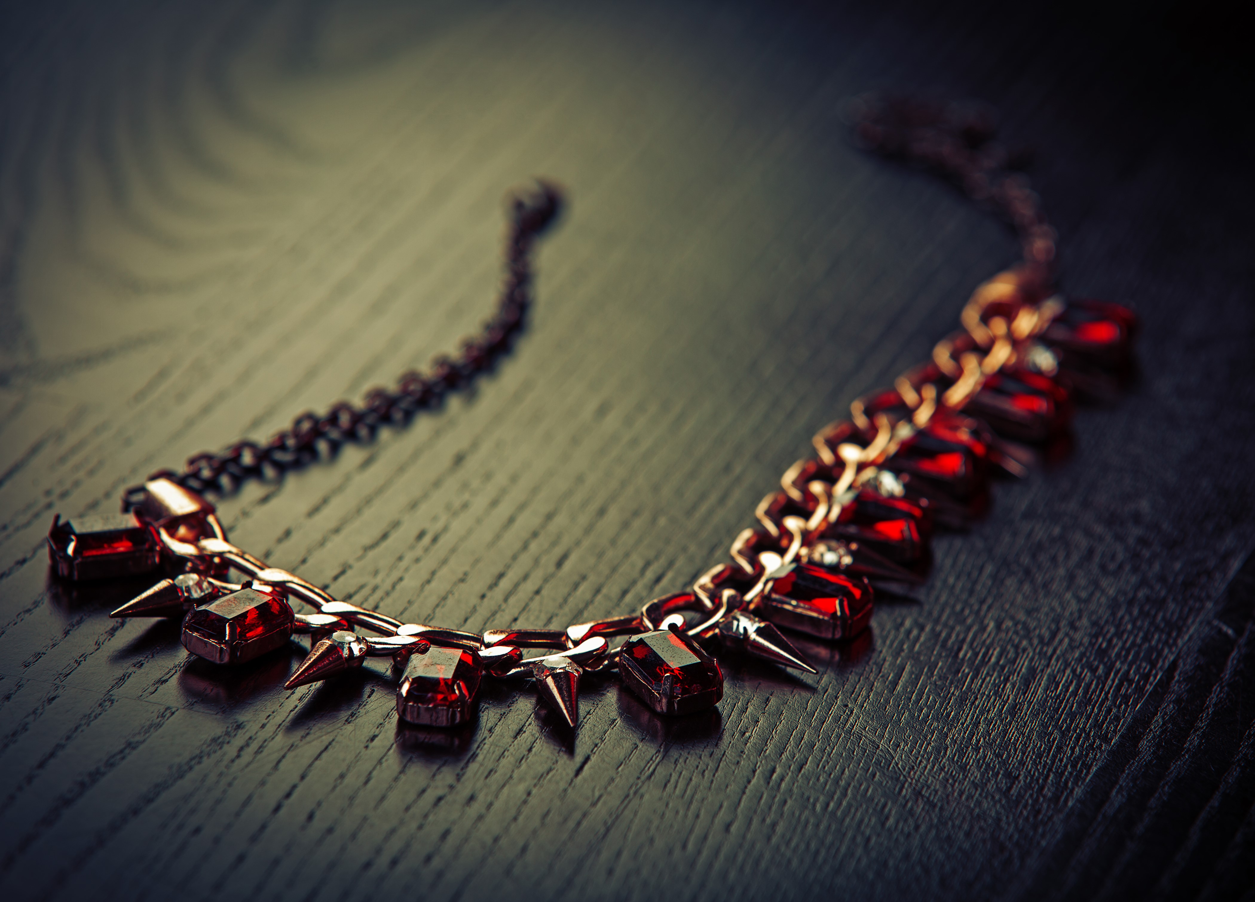 4K Necklace with red gems on wood planks HD Wallpaper