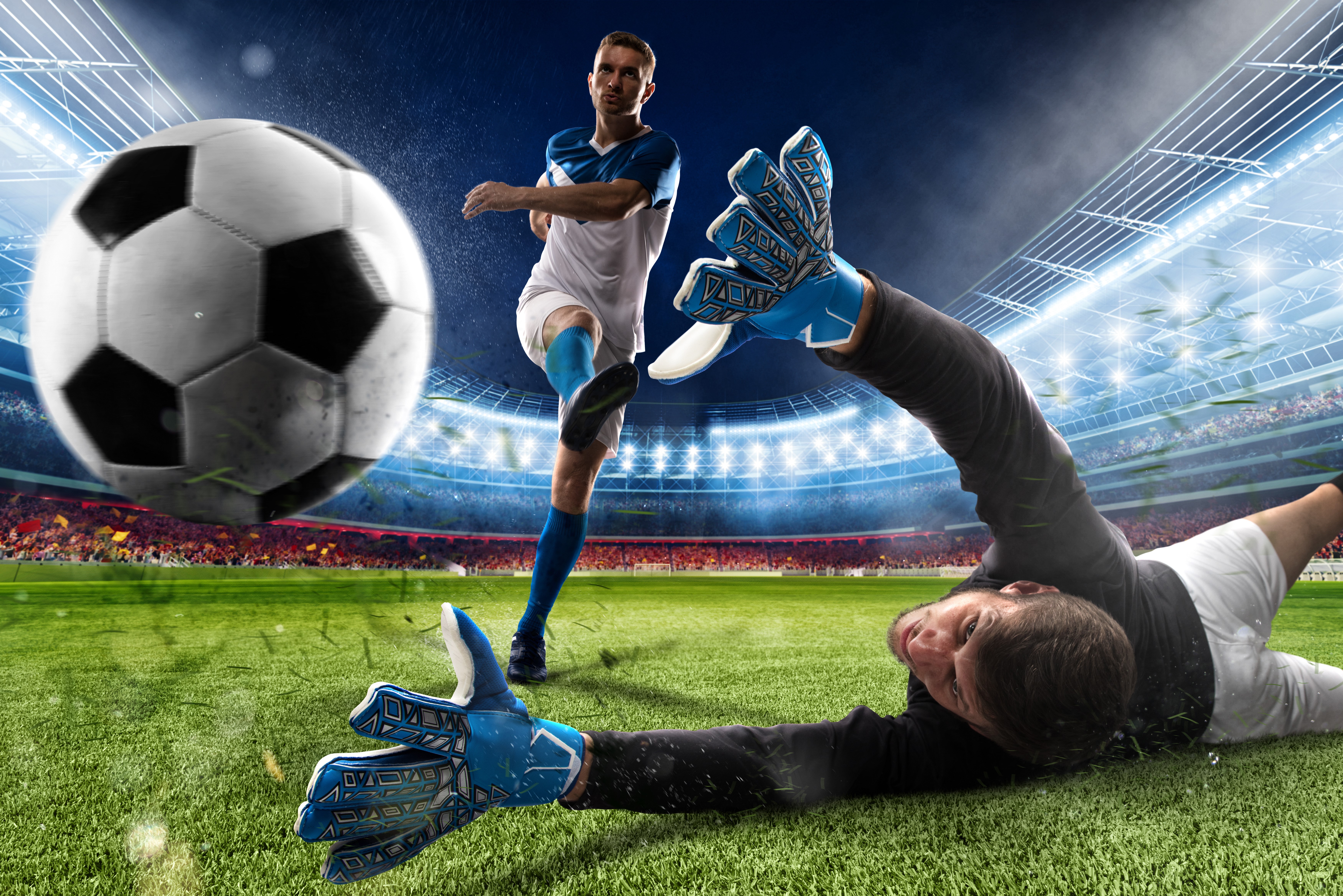 Soccer players in stadium, goalkeeper saves ball HD Wallpaper