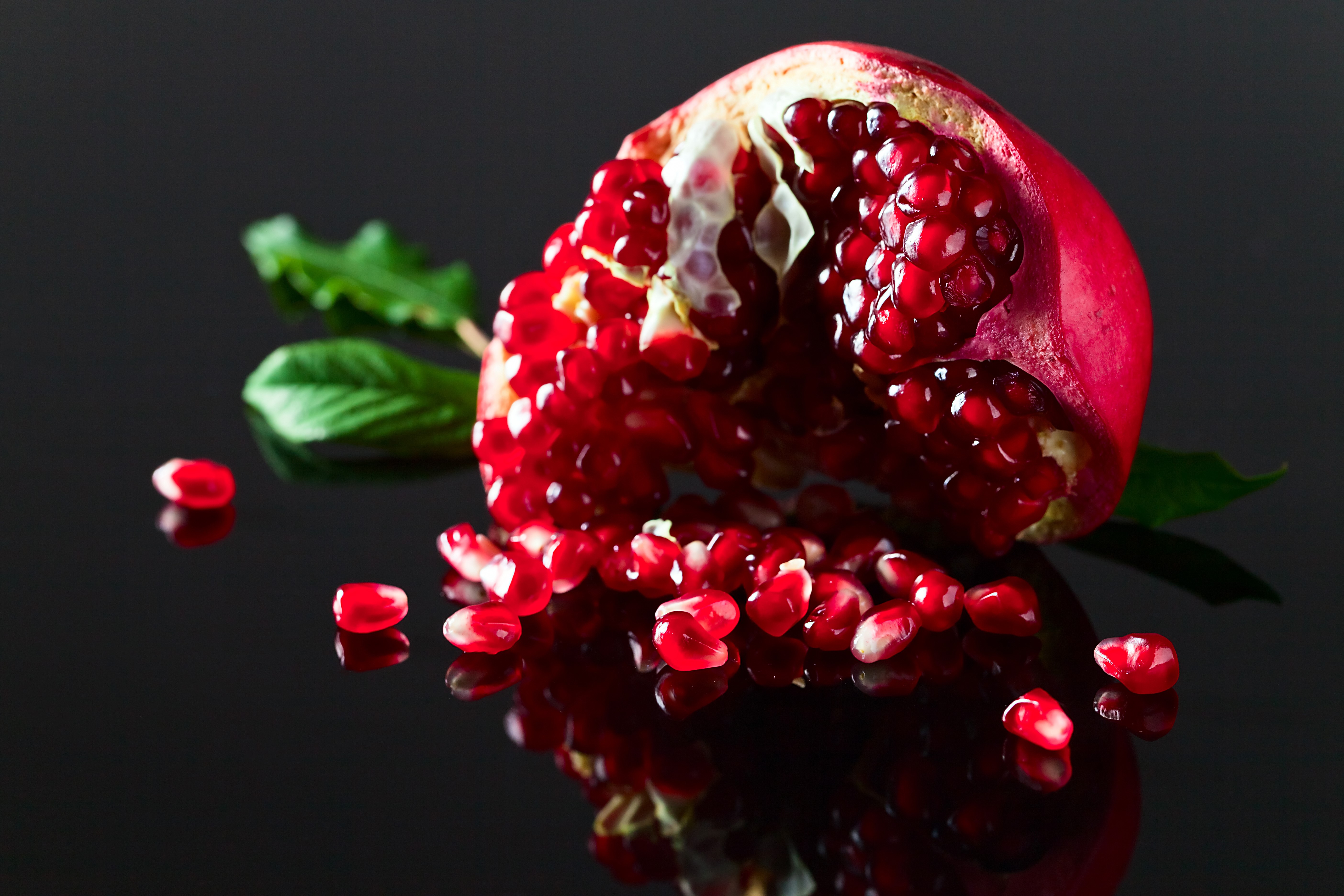Pomegranate with seeds and leaves HD Wallpaper