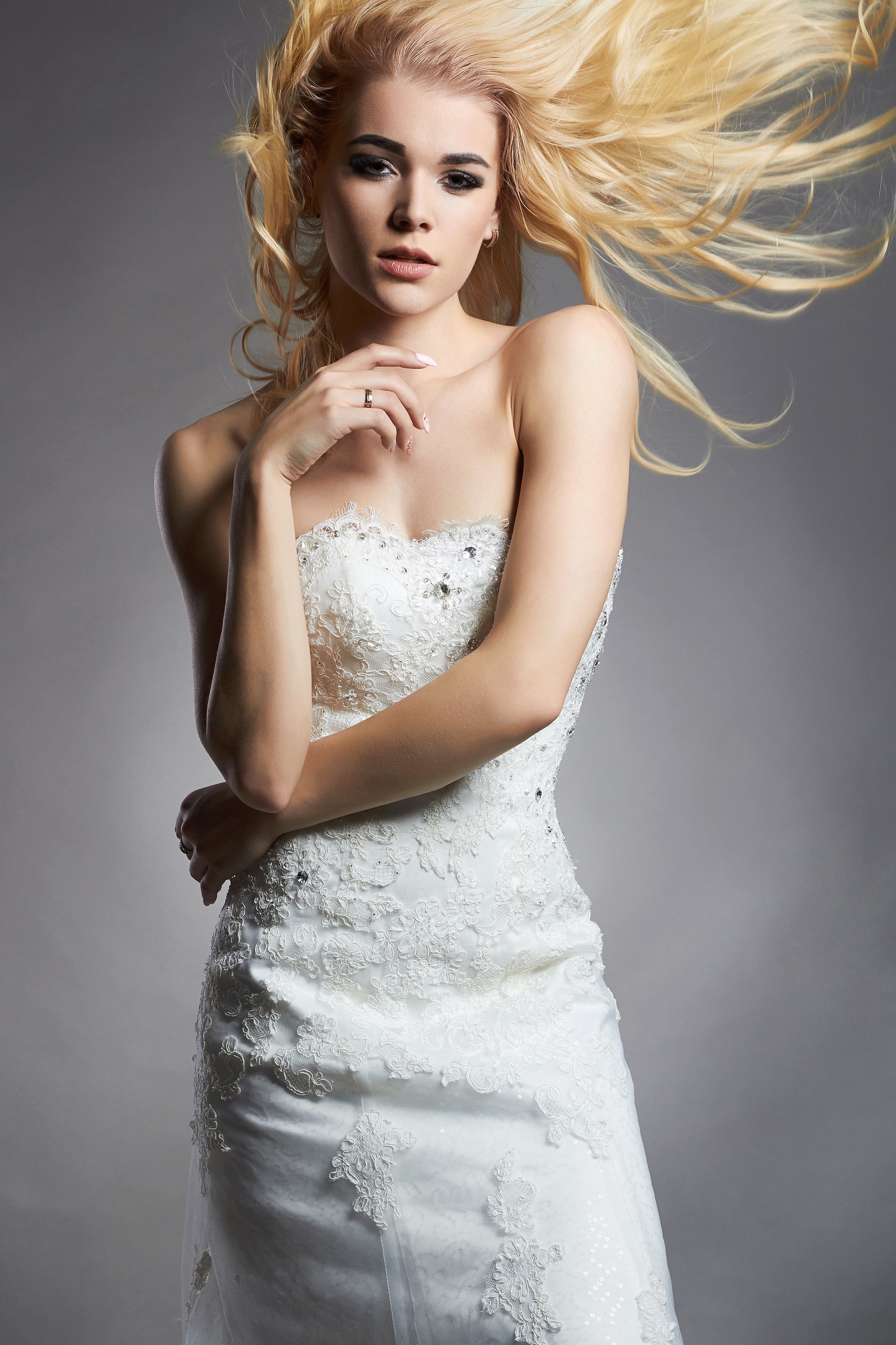Blonde bride in white dress with windblown hair HD Phone Wallpaper