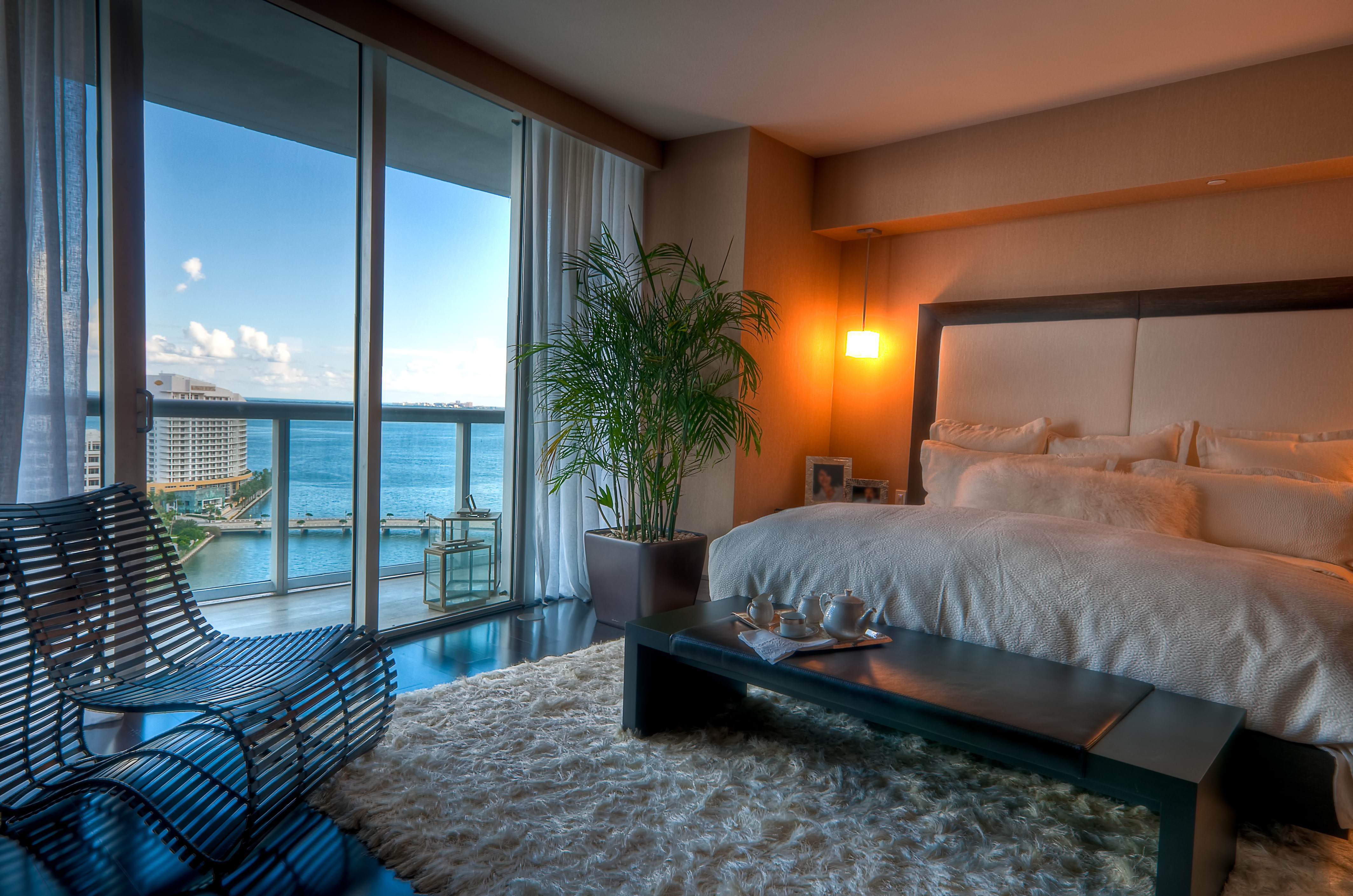 Bedroom with a view and a modern chair HD Wallpaper