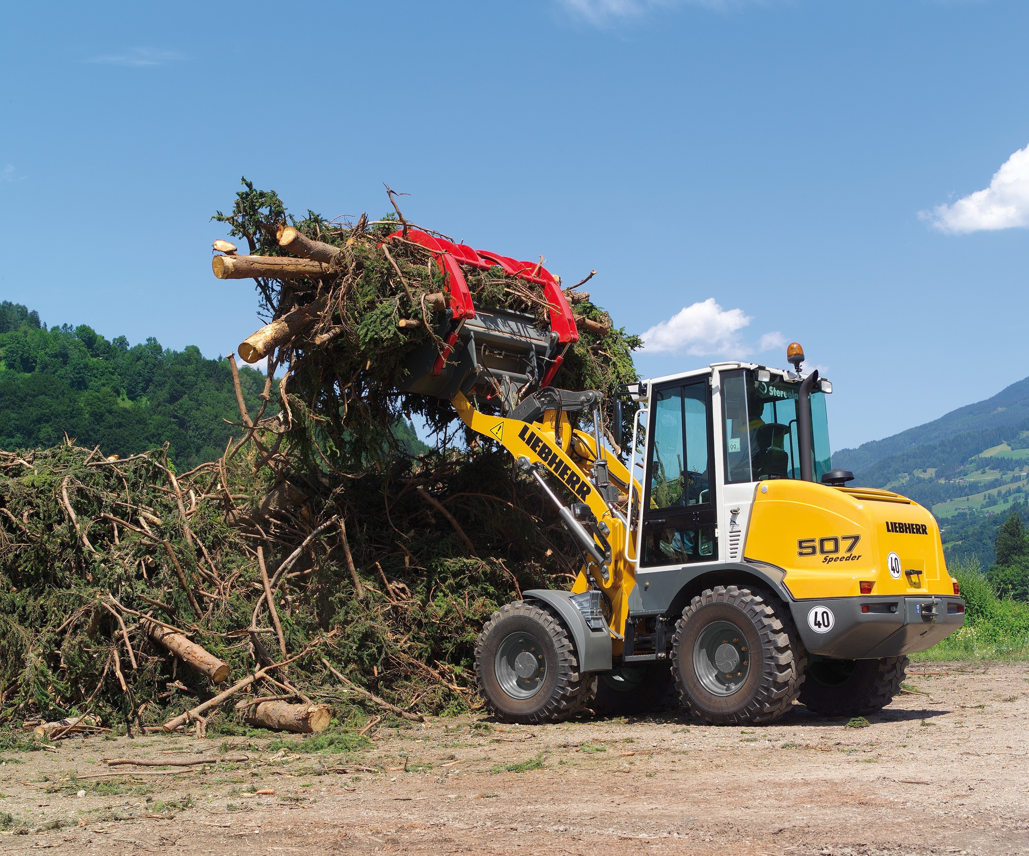 Liebherr L 507 Speeder loader with branches HD Wallpaper