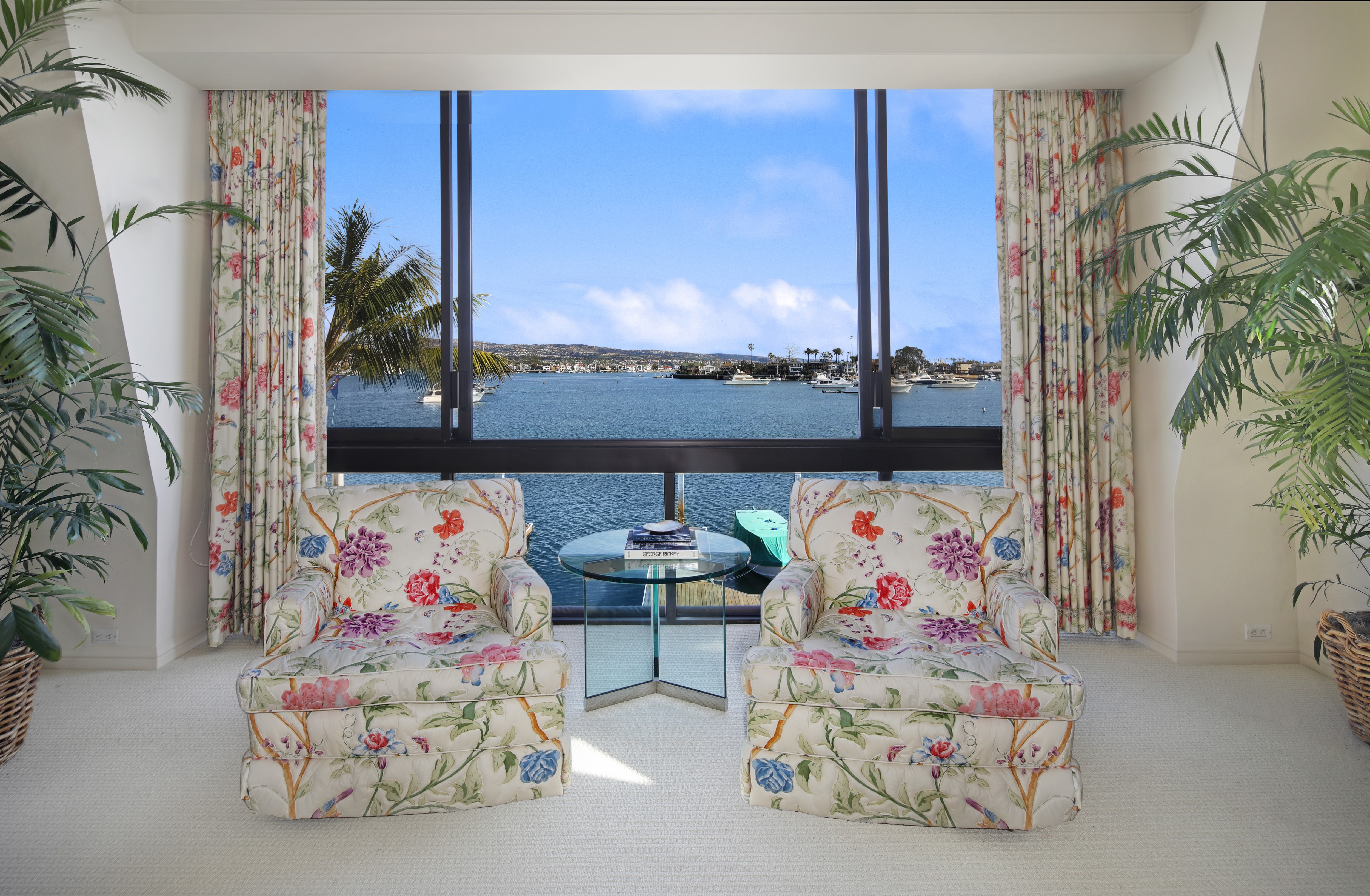 Living room with two armchairs and a window view HD Wallpaper