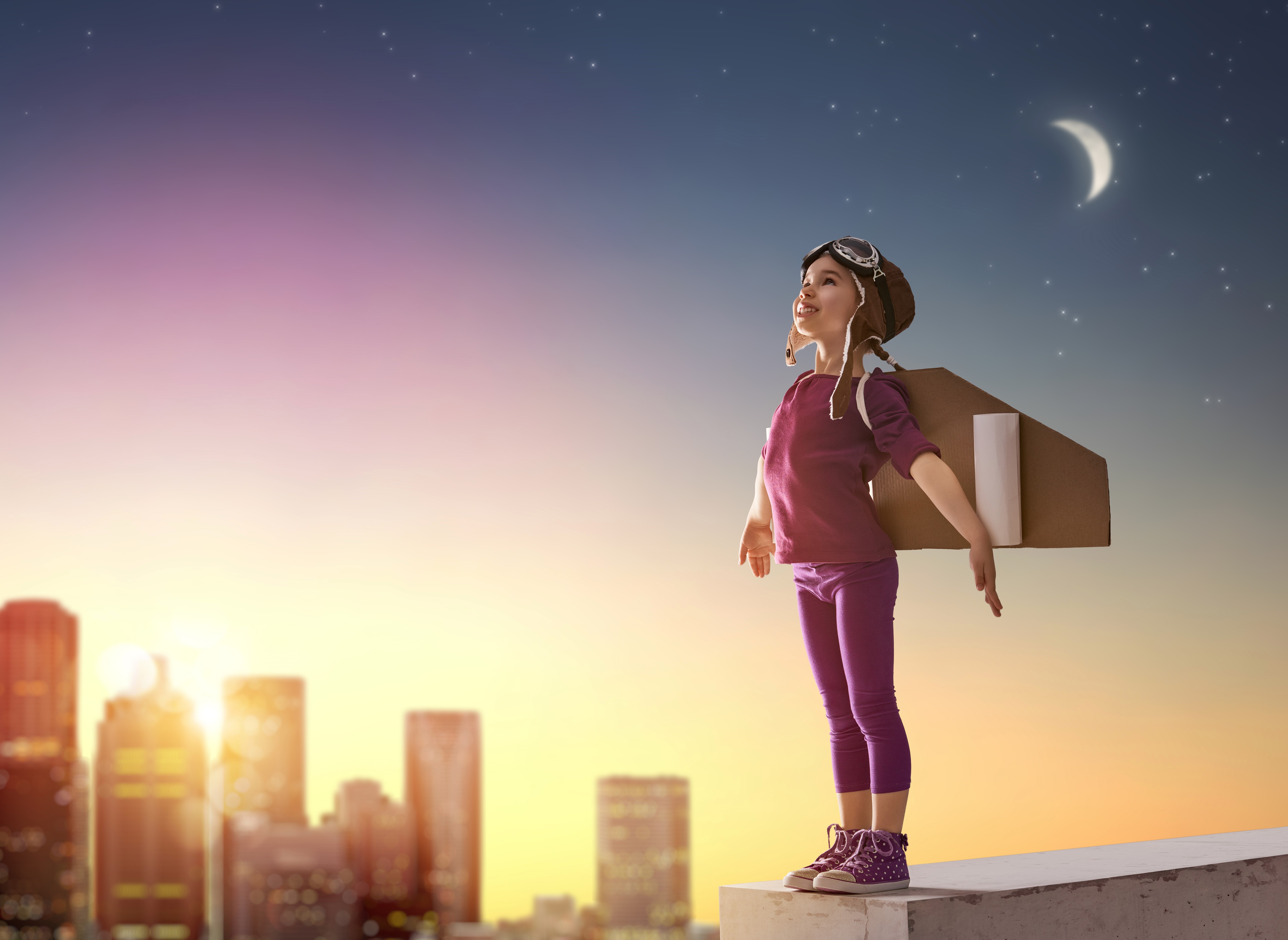 Girl with cardboard jetpack on rooftop at night HD Wallpaper