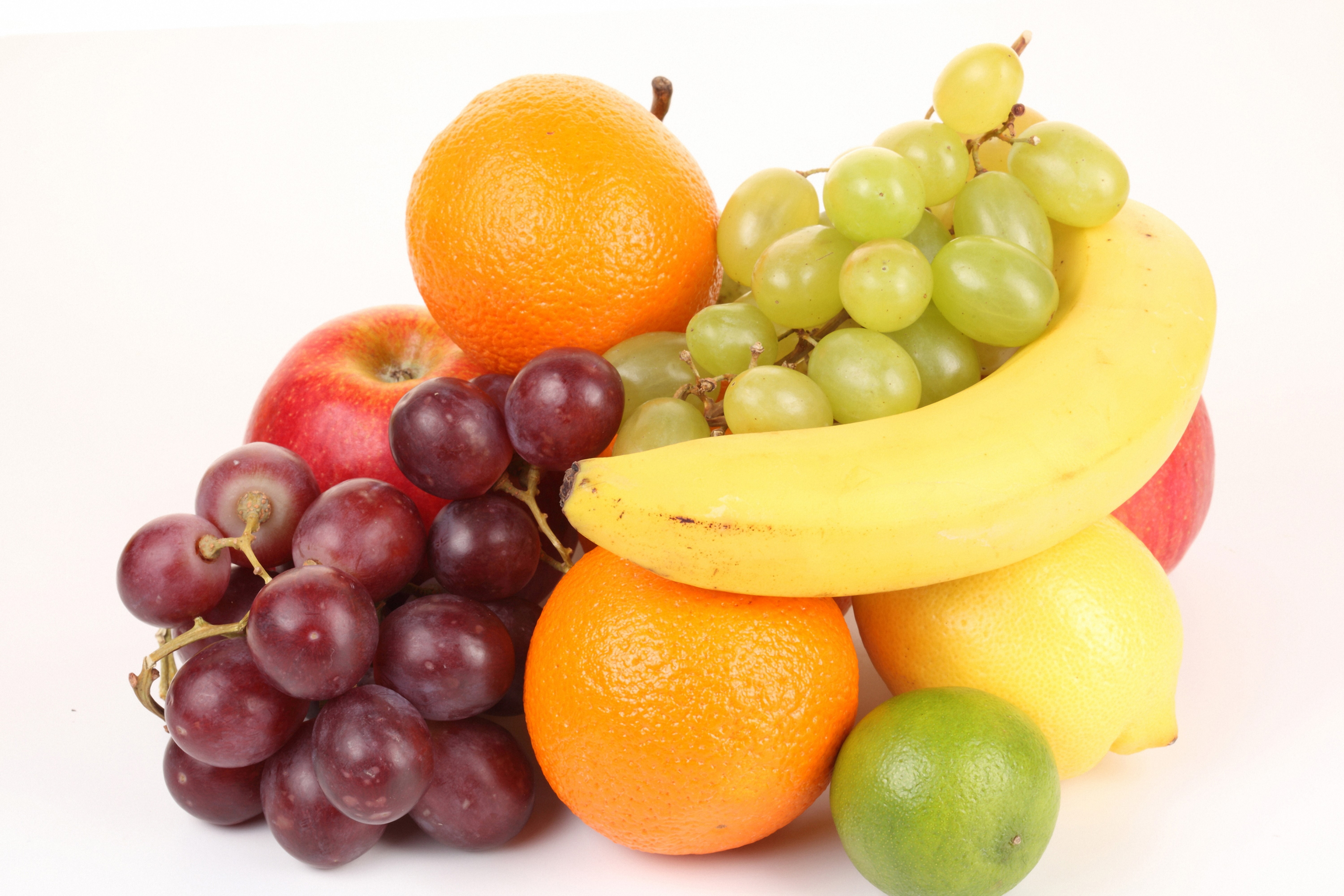 Assortment of Fruits: Grapes, Bananas, Oranges, Apple, Lemon, and Lime HD Wallpaper