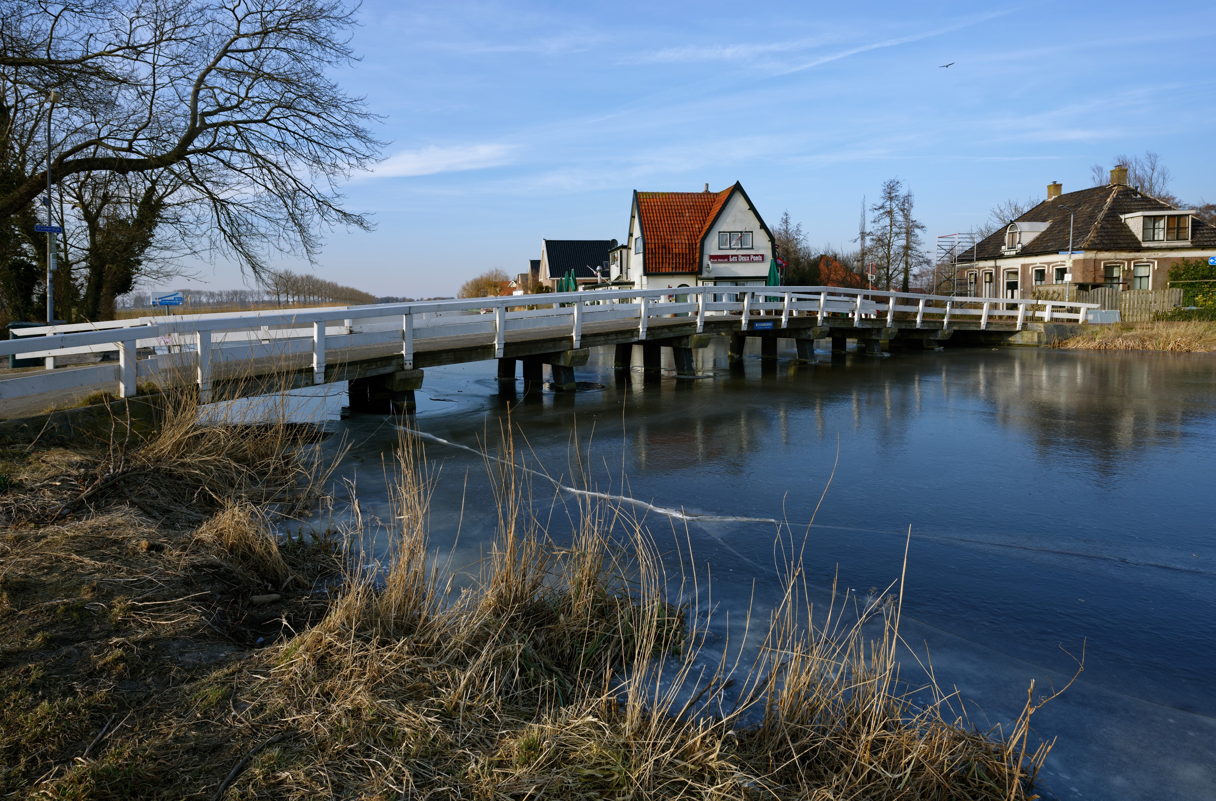 Bridge over frozen river in Oudendijk, Netherlands HD Wallpaper