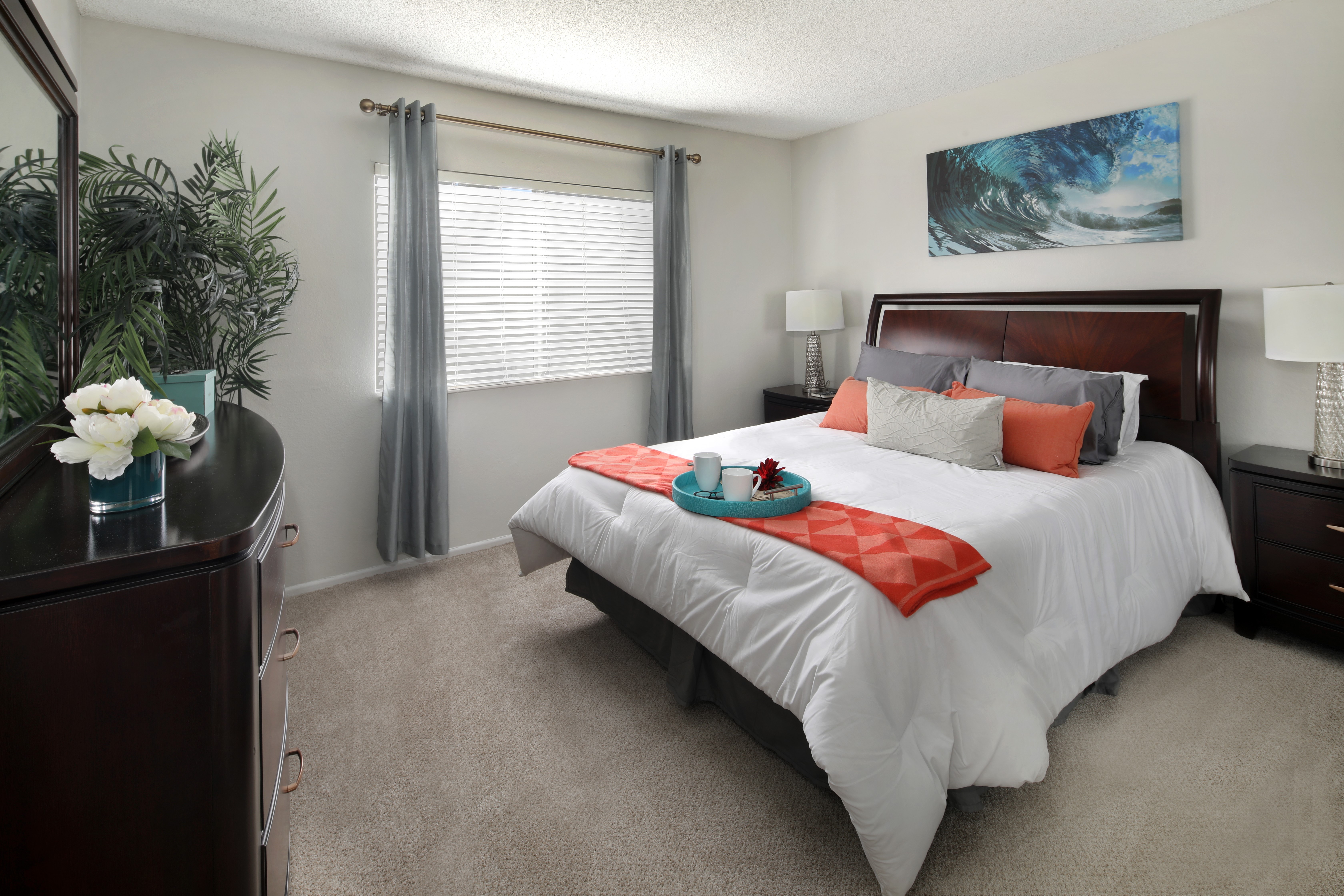 Bedroom with a bed, dresser, and artwork HD Wallpaper