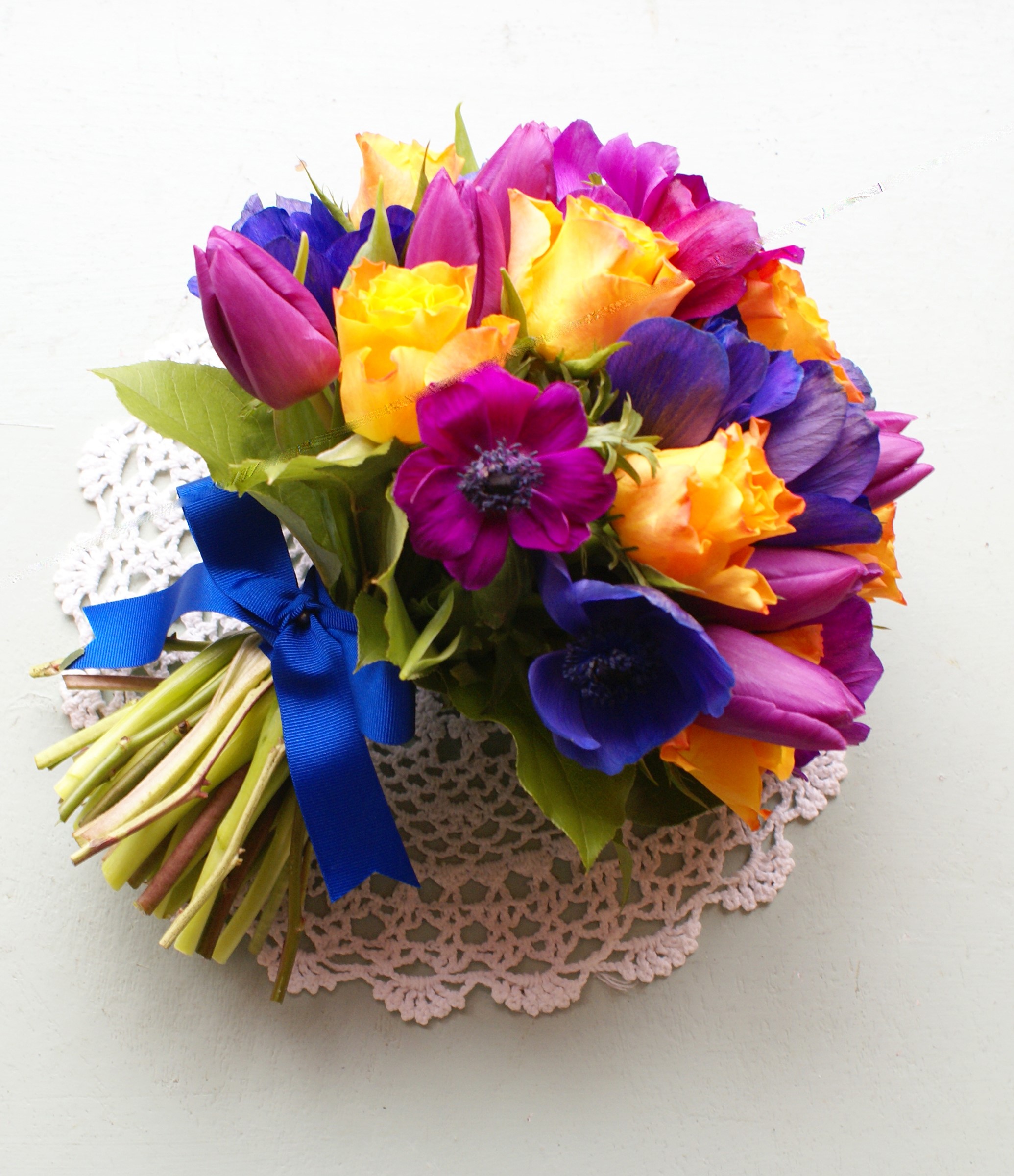 Colorful bouquet of roses, tulips, and anemones with blue ribbon HD Wallpaper