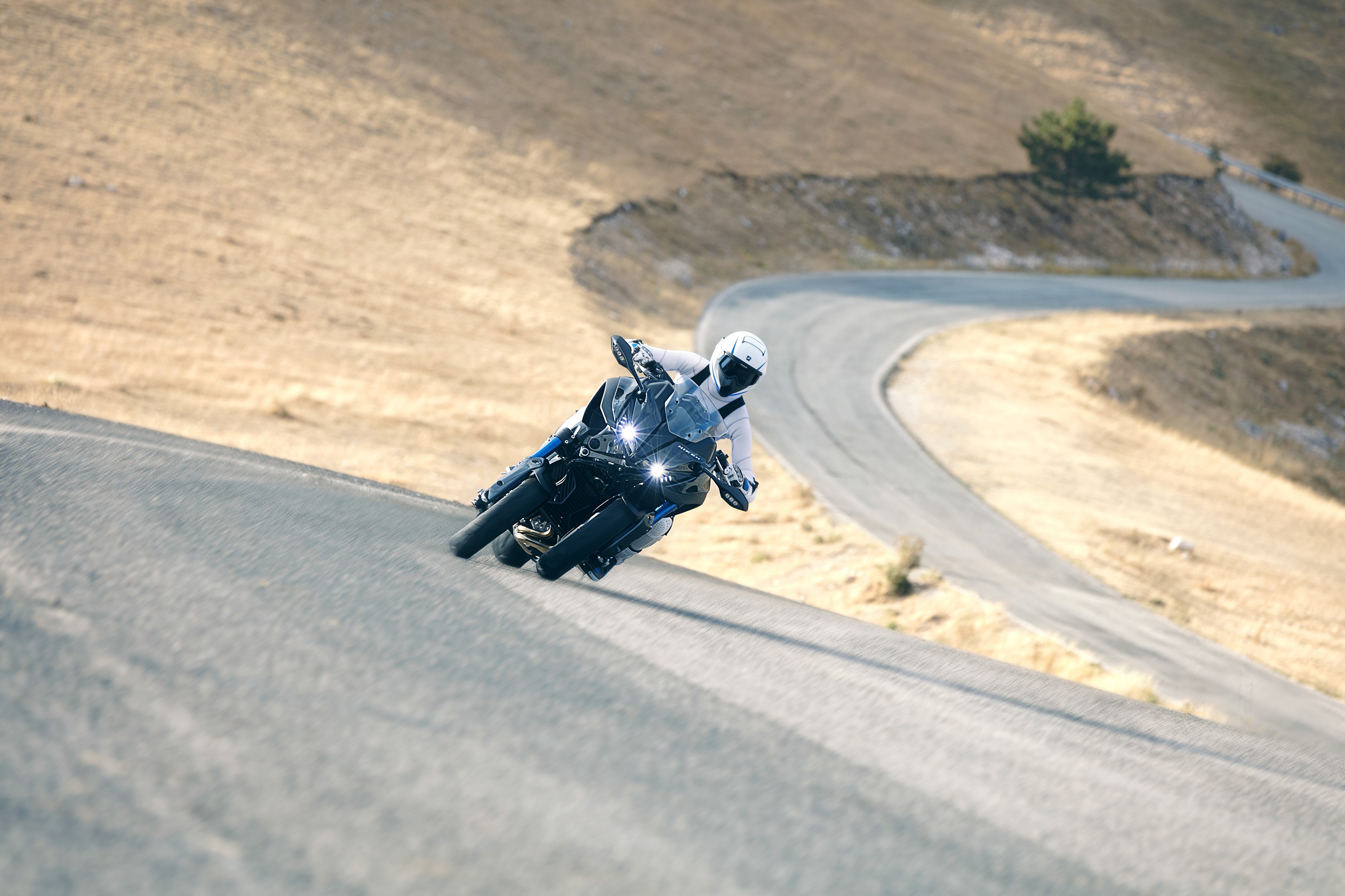 Yamaha Niken motorcycle on a winding mountain road HD Wallpaper