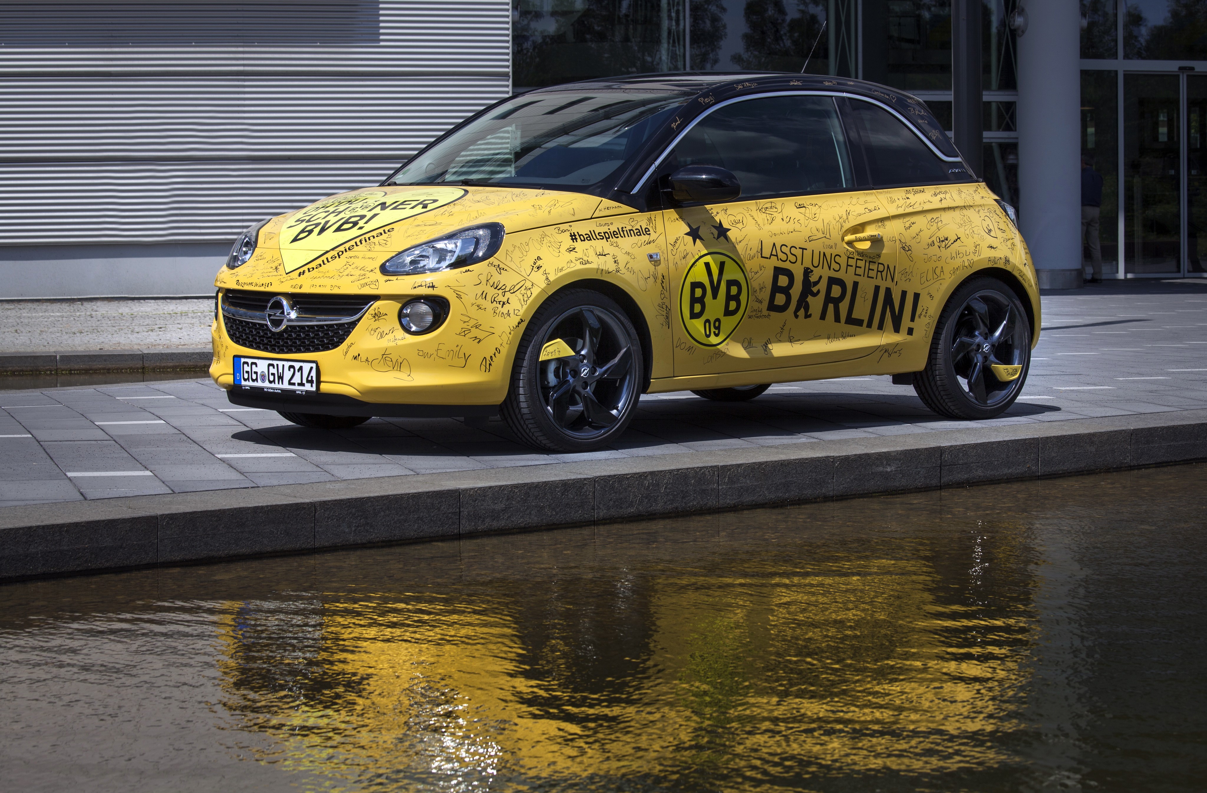 Yellow Opel Adam with BVB Signatures HD Wallpaper