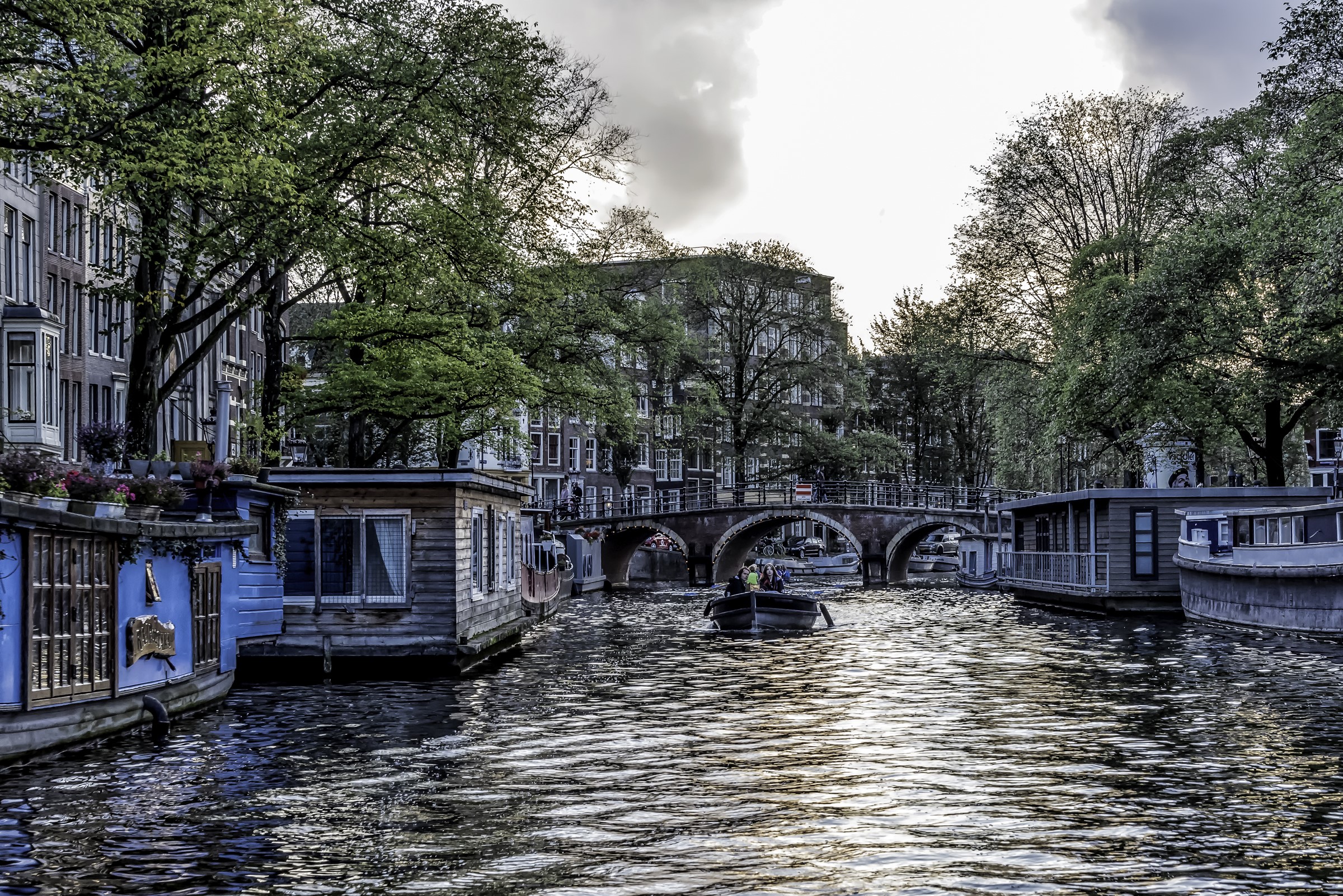 Amsterdam canal with houseboats and bridge HD Wallpaper