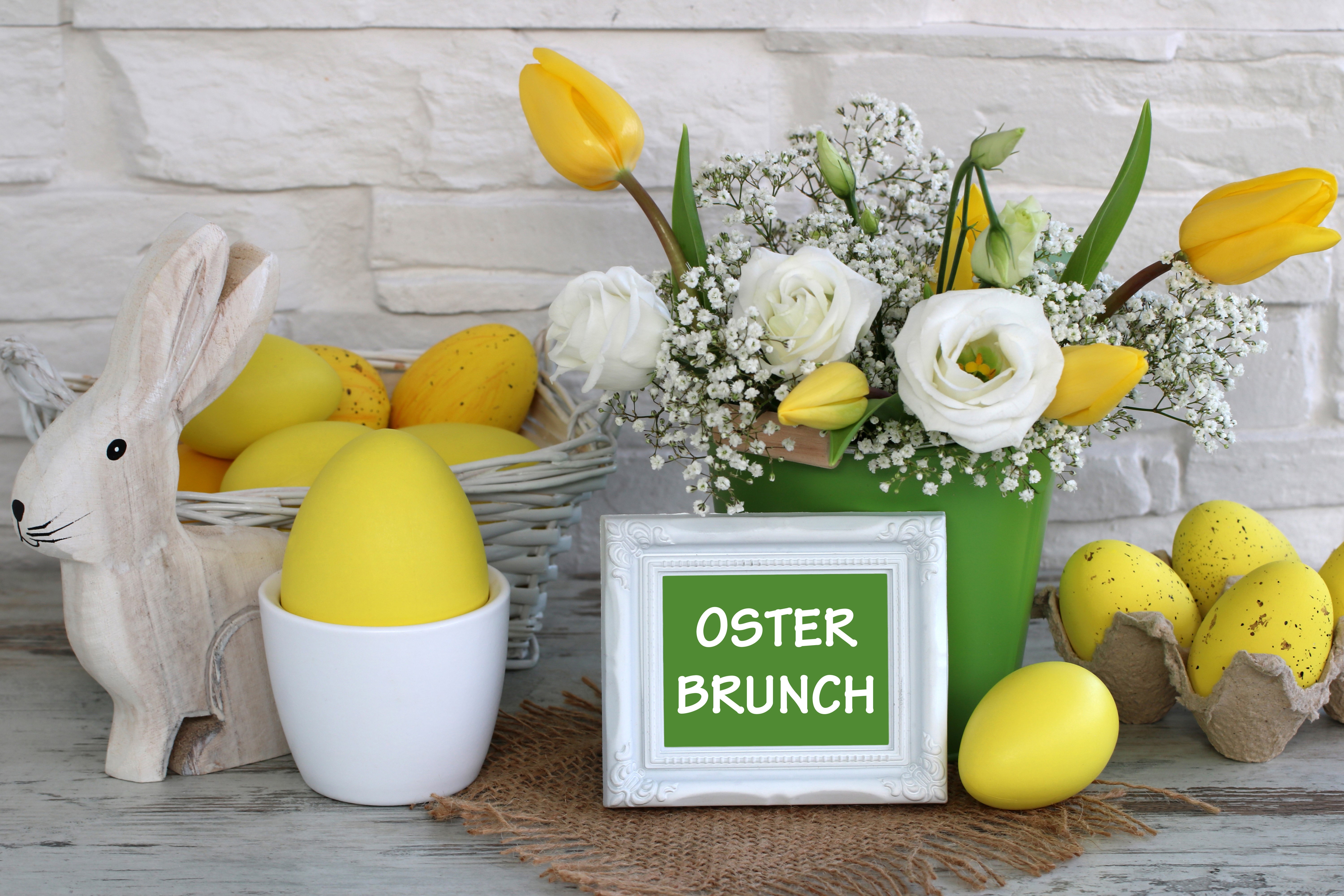 Easter Brunch Decoration with Yellow Eggs and Flowers HD Wallpaper