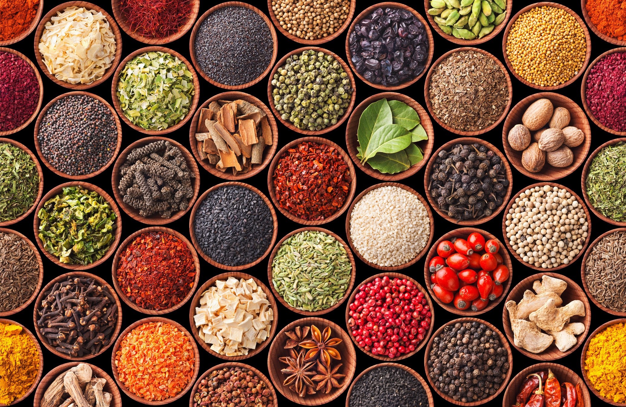 A variety of spices in wooden bowls HD Wallpaper