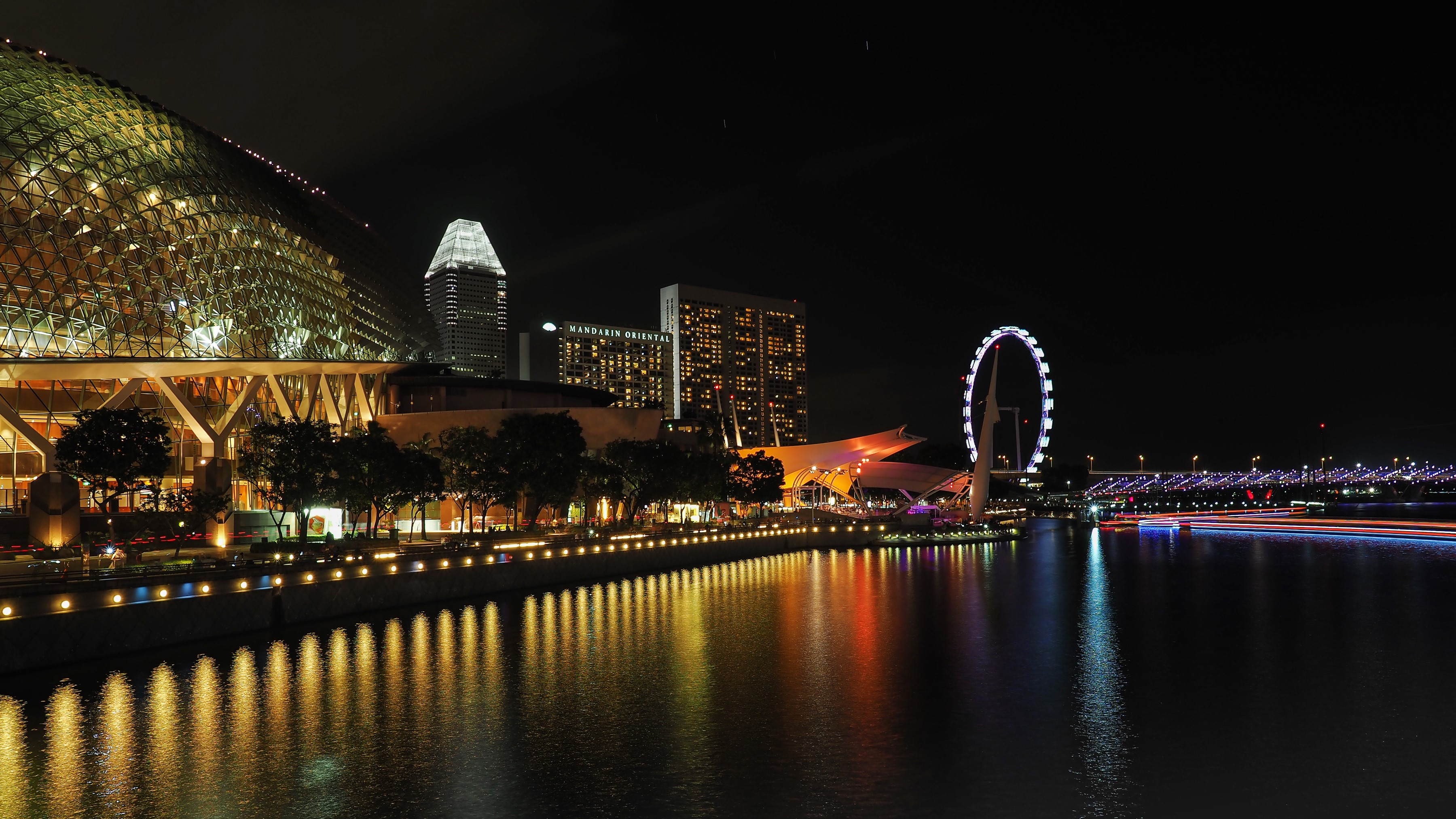 Singapore skyline at night with Ferris wheel and buildings HD Wallpaper