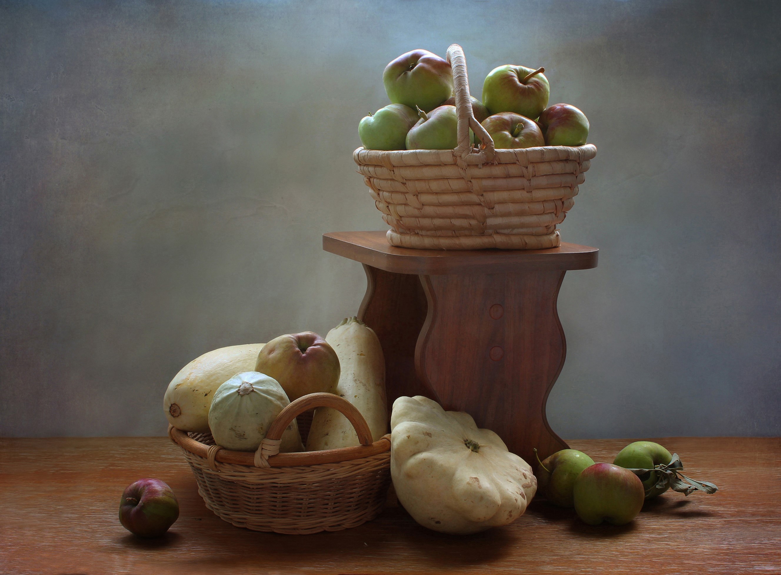 Apples and vegetables in wicker baskets on a wooden table HD Wallpaper