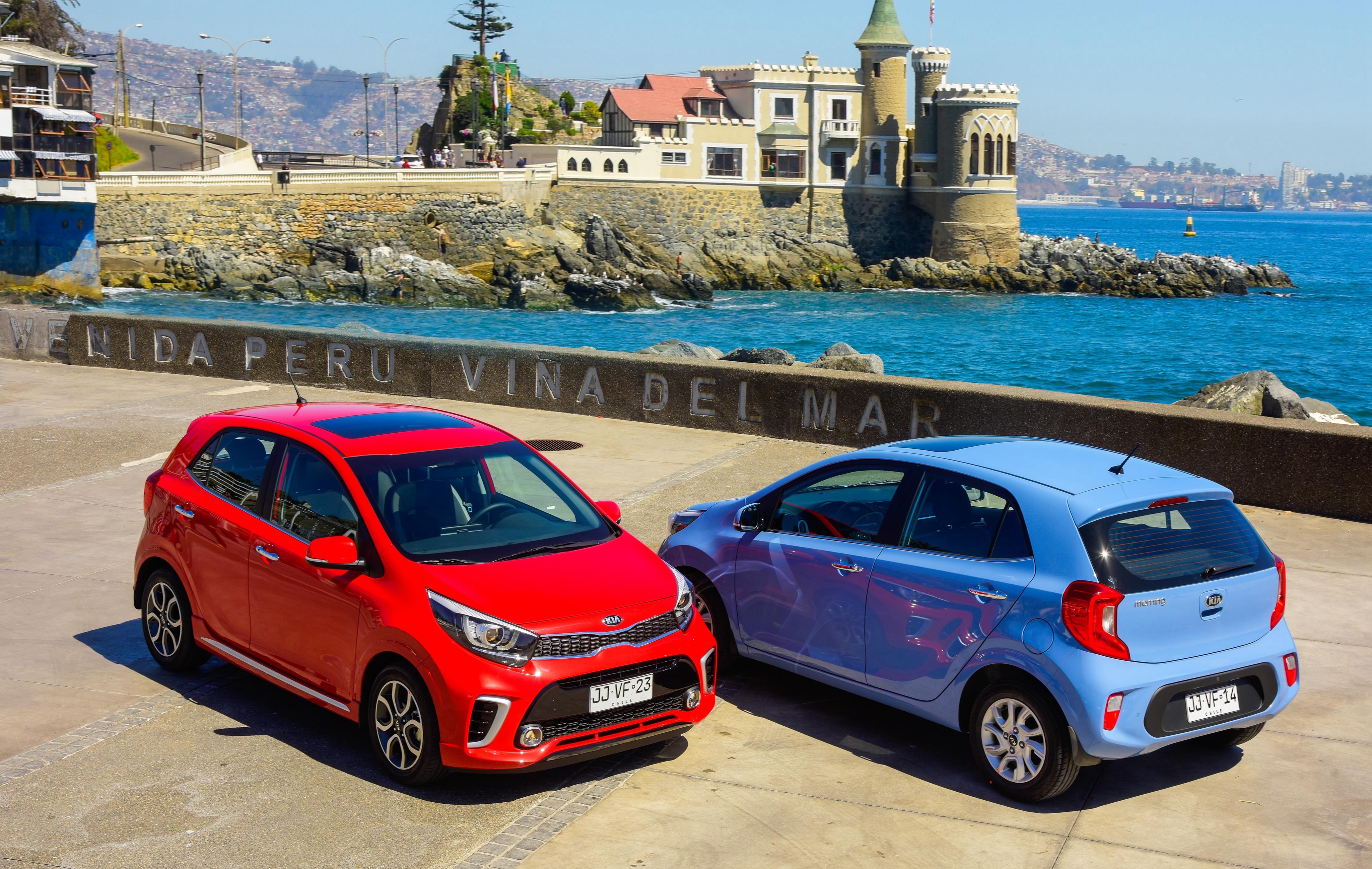 Two Kia Picanto cars by the sea HD Wallpaper