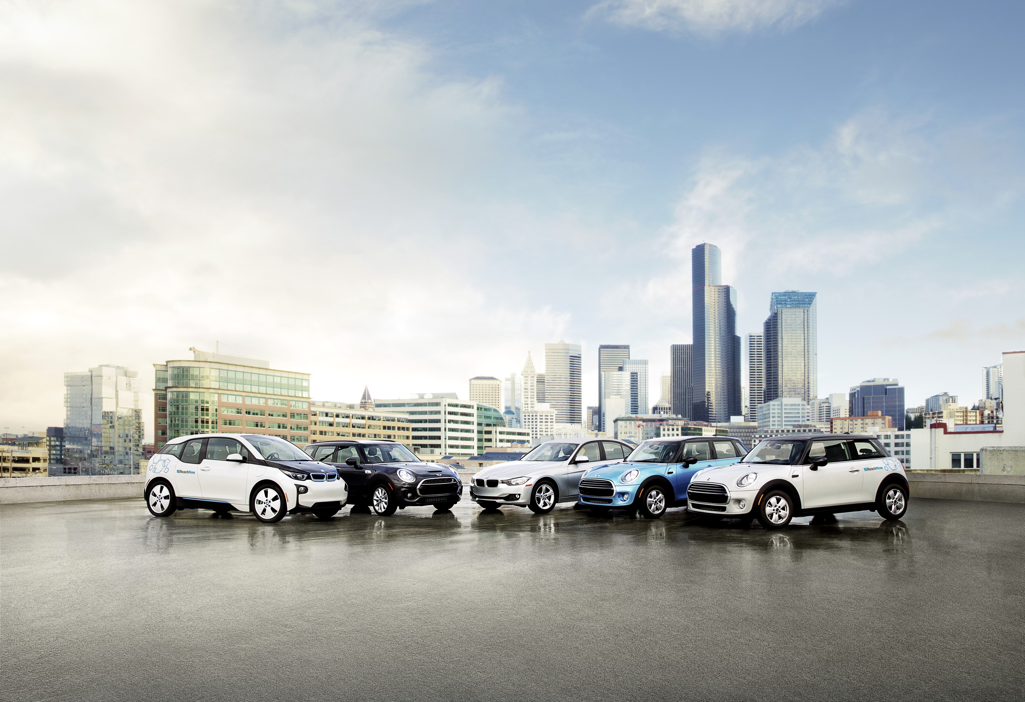BMW and Mini cars in a city skyline HD Wallpaper