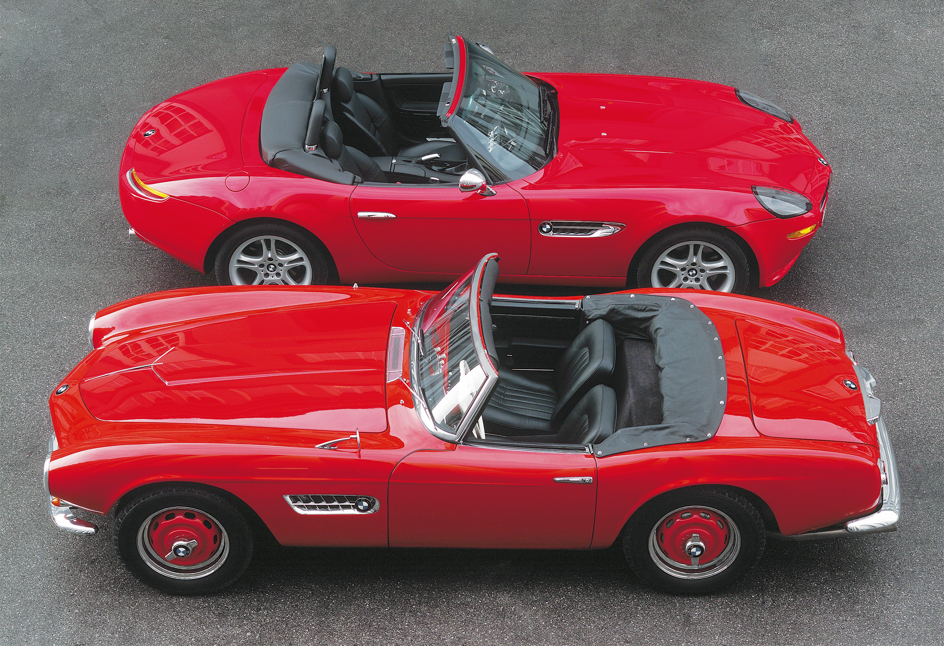 Two red BMW convertible cars HD Wallpaper