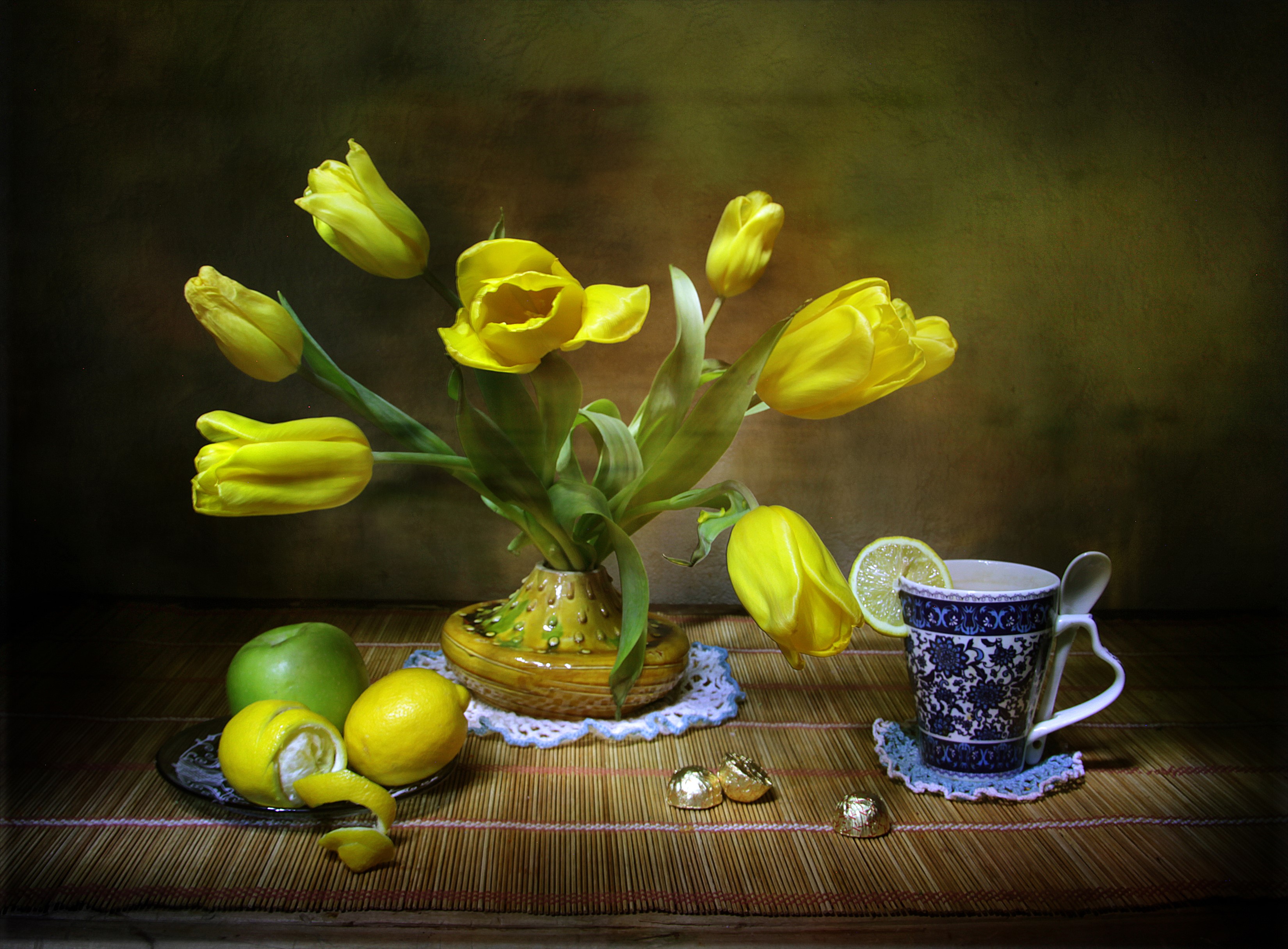 Still-life with yellow tulips, lemons, and a cup HD Wallpaper