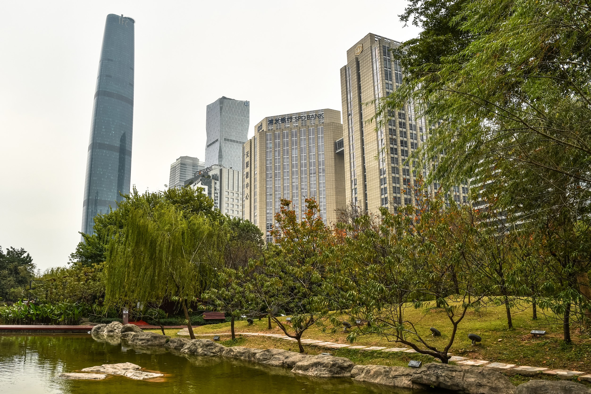 Guangzhou skyline with park and pond HD Wallpaper