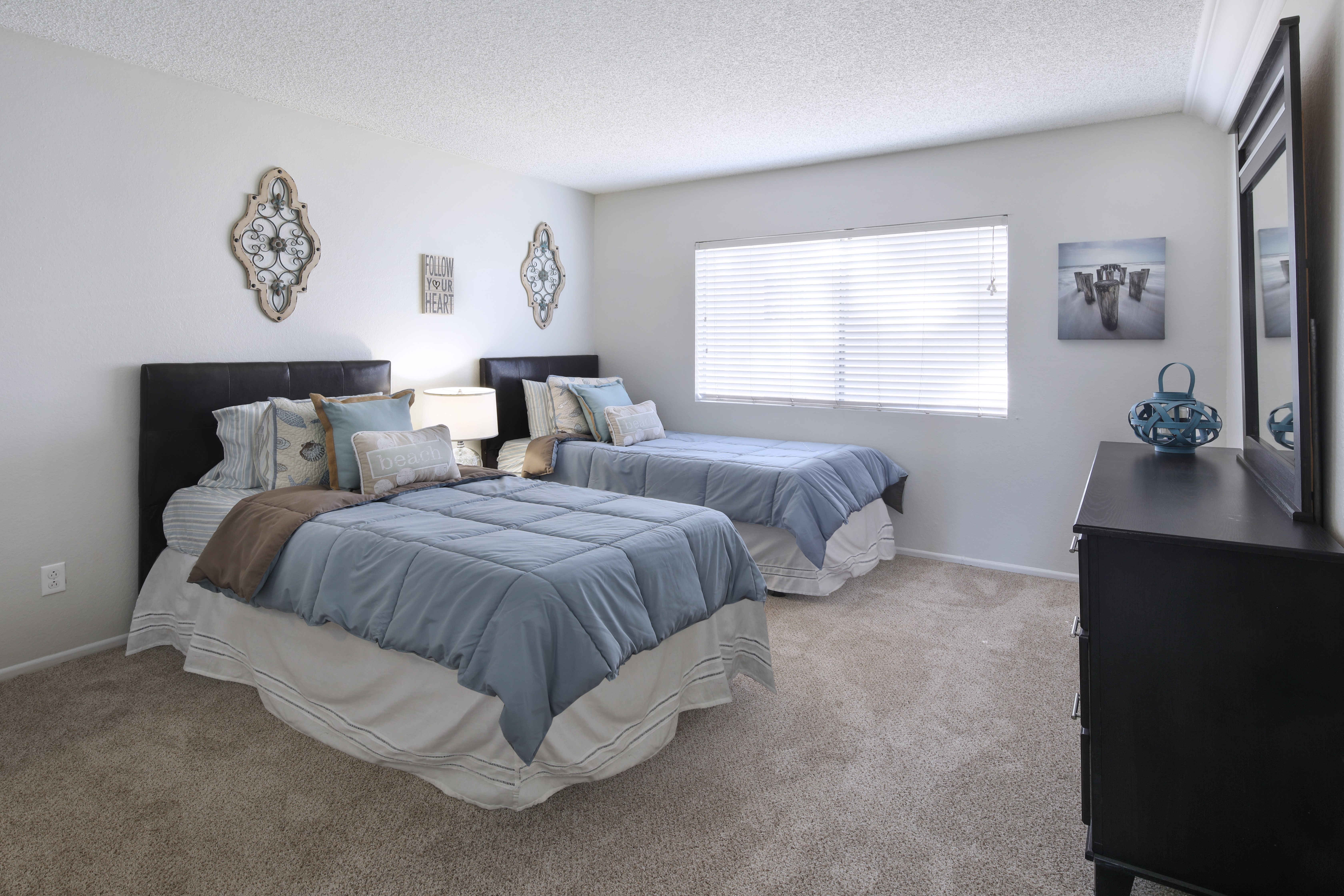 Bedroom with two beds and dresser HD Wallpaper