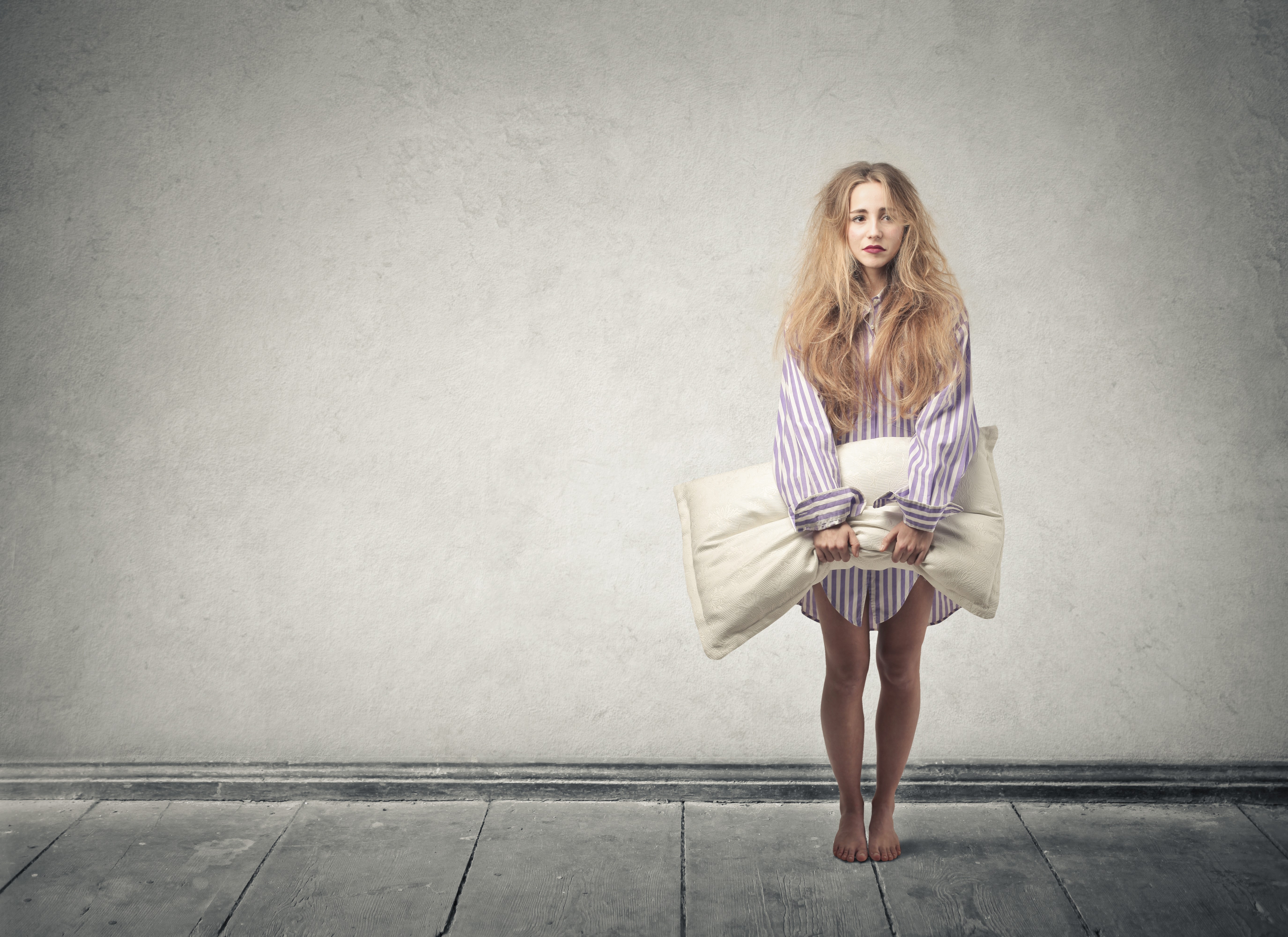Blonde girl holding a pillow HD Wallpaper