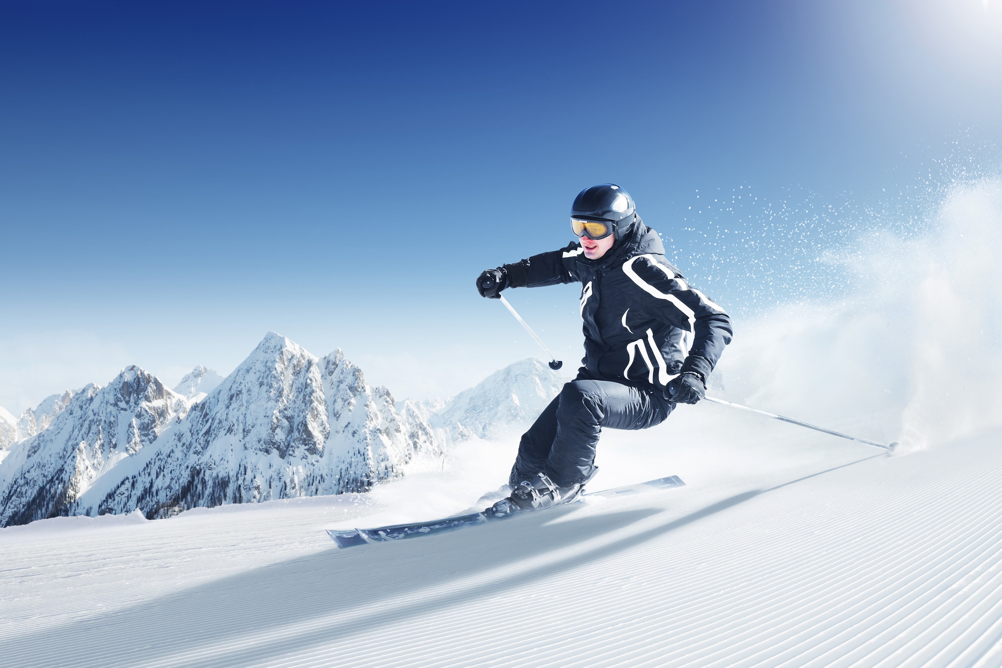 Skiing Down a Snowy Mountain HD Wallpaper