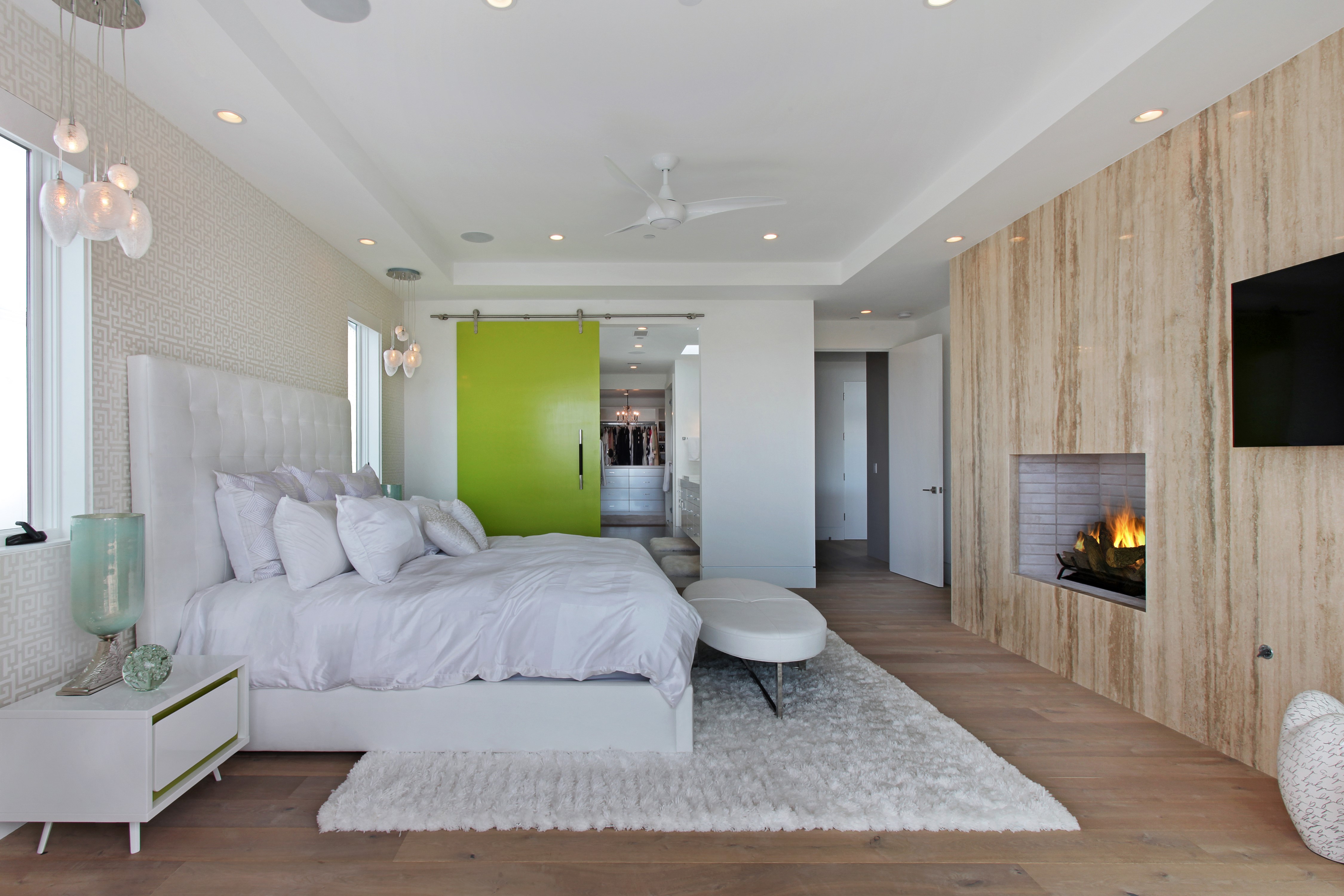 Modern Bedroom with Fireplace and Green Barn Door HD Wallpaper