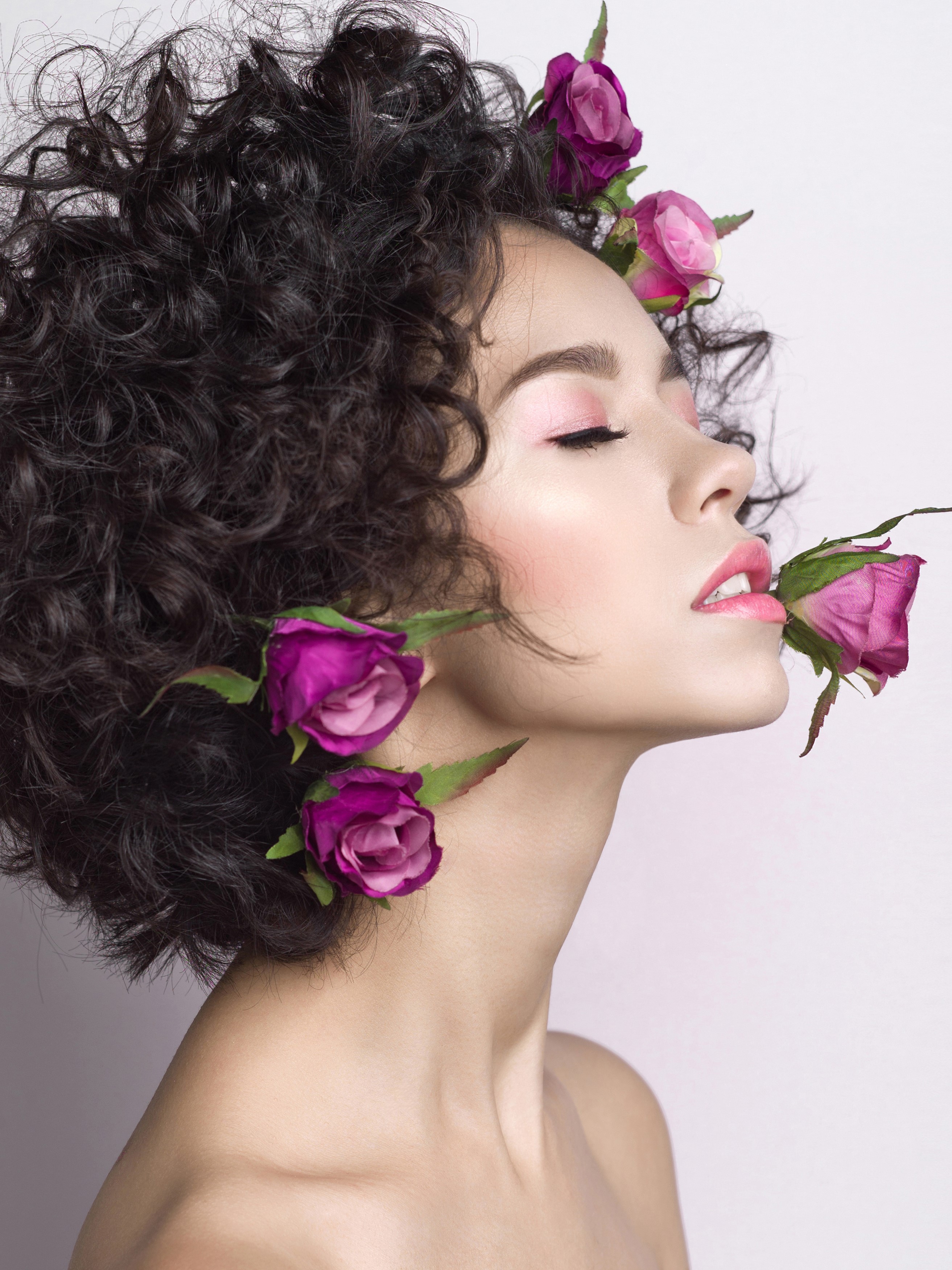 Woman with curly hair and roses HD Phone Wallpaper
